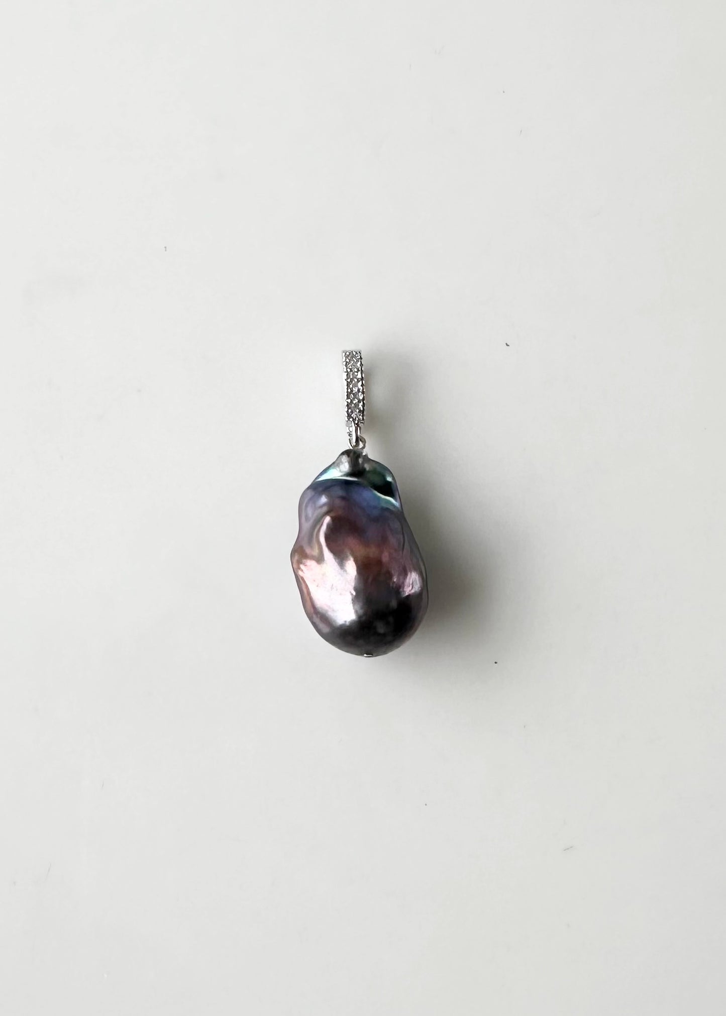 Large Baroque Black Freshwater Pearl Pendant on Gold-Plated Bail with In-Laid Cubic Zirconia.  This Clip-On Pendant allows you to wear it with many of your favorite Pearl Necklaces.