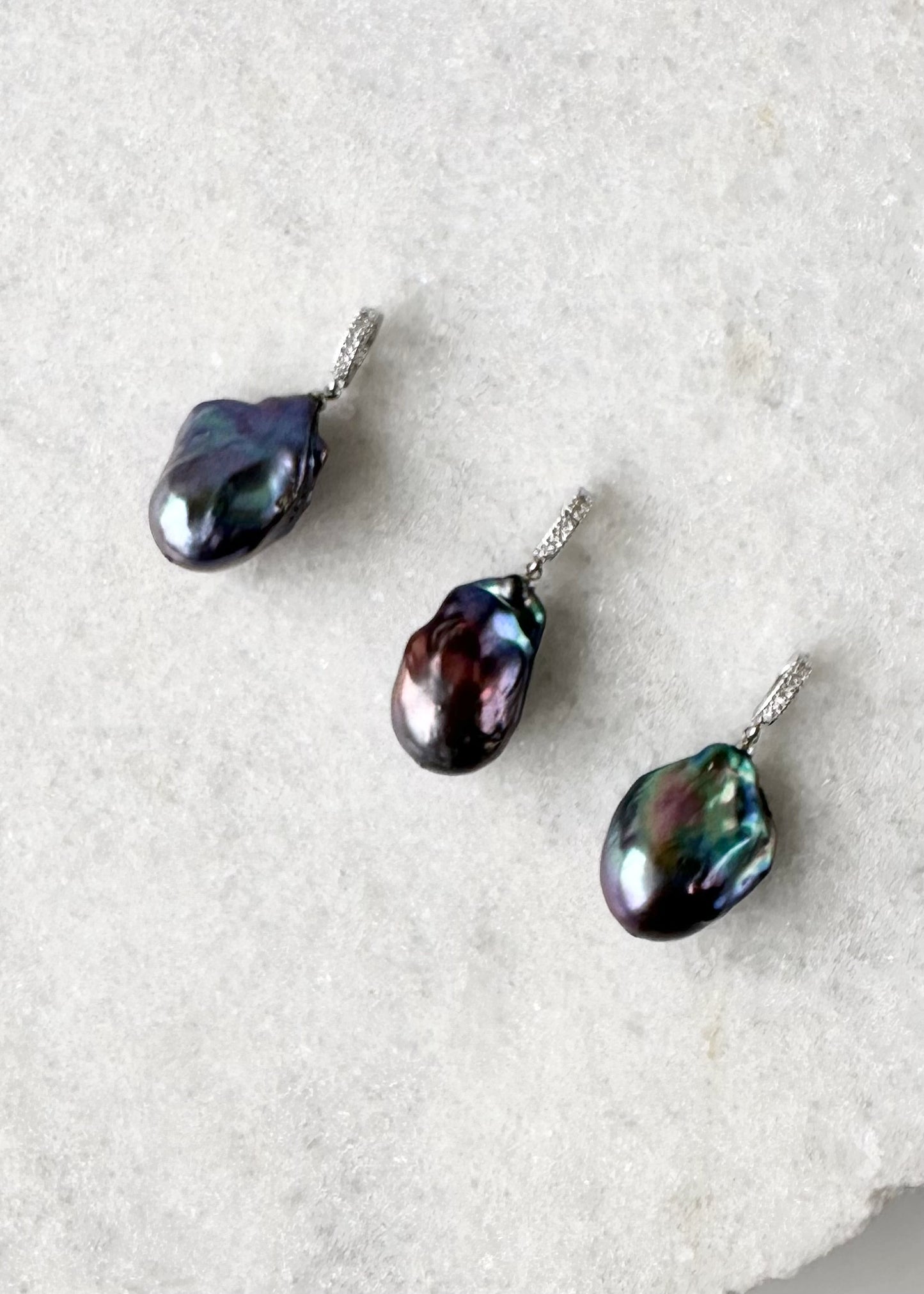 Large Baroque White Freshwater Pearl Pendant on Gold-Plated Bail with In-Laid Cubic Zirconia.  This Clip-On Pendant allows you to wear it with many of your favorite Pearl Necklaces. Three showing variety