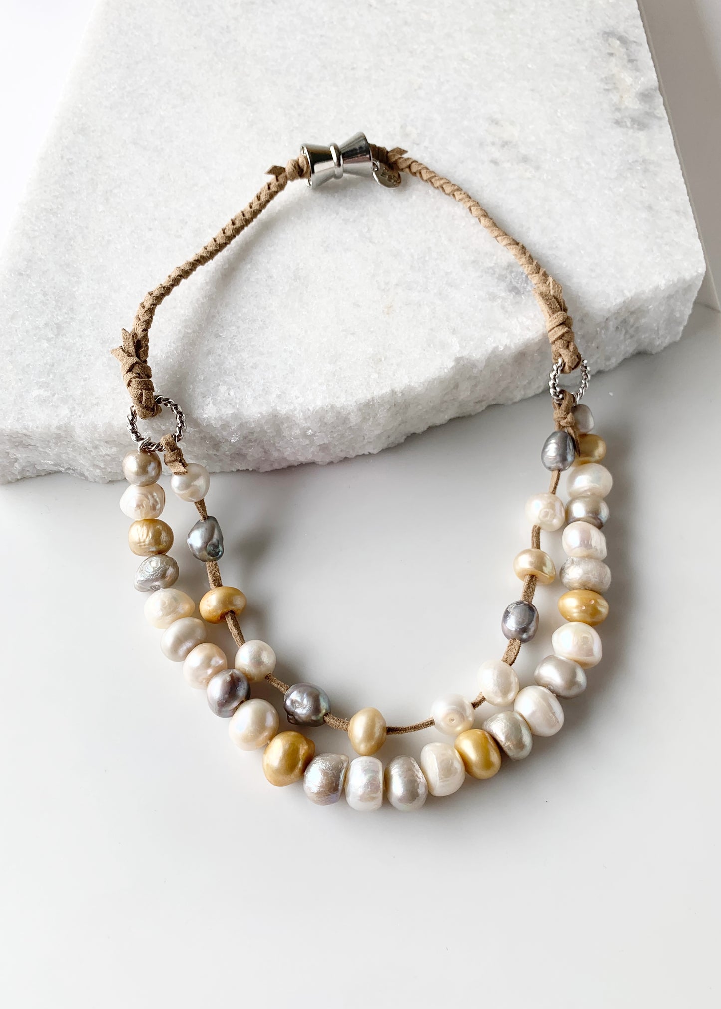 Two Strand White/Gold/Silver Freshwater Pearl Necklace, one Strand Knotted, the second Strand with Floating Pearls Held by a White Gold-Plated Ring.  A strong Secure Magnetic Clasp allows for Easy Wear.