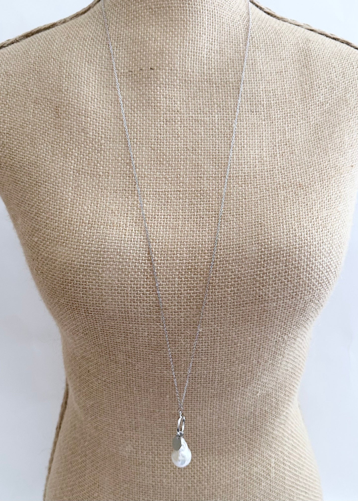 Extra Large White Baroque Freshwater Pearl on Long White Gold-Plated Chain. On Bust