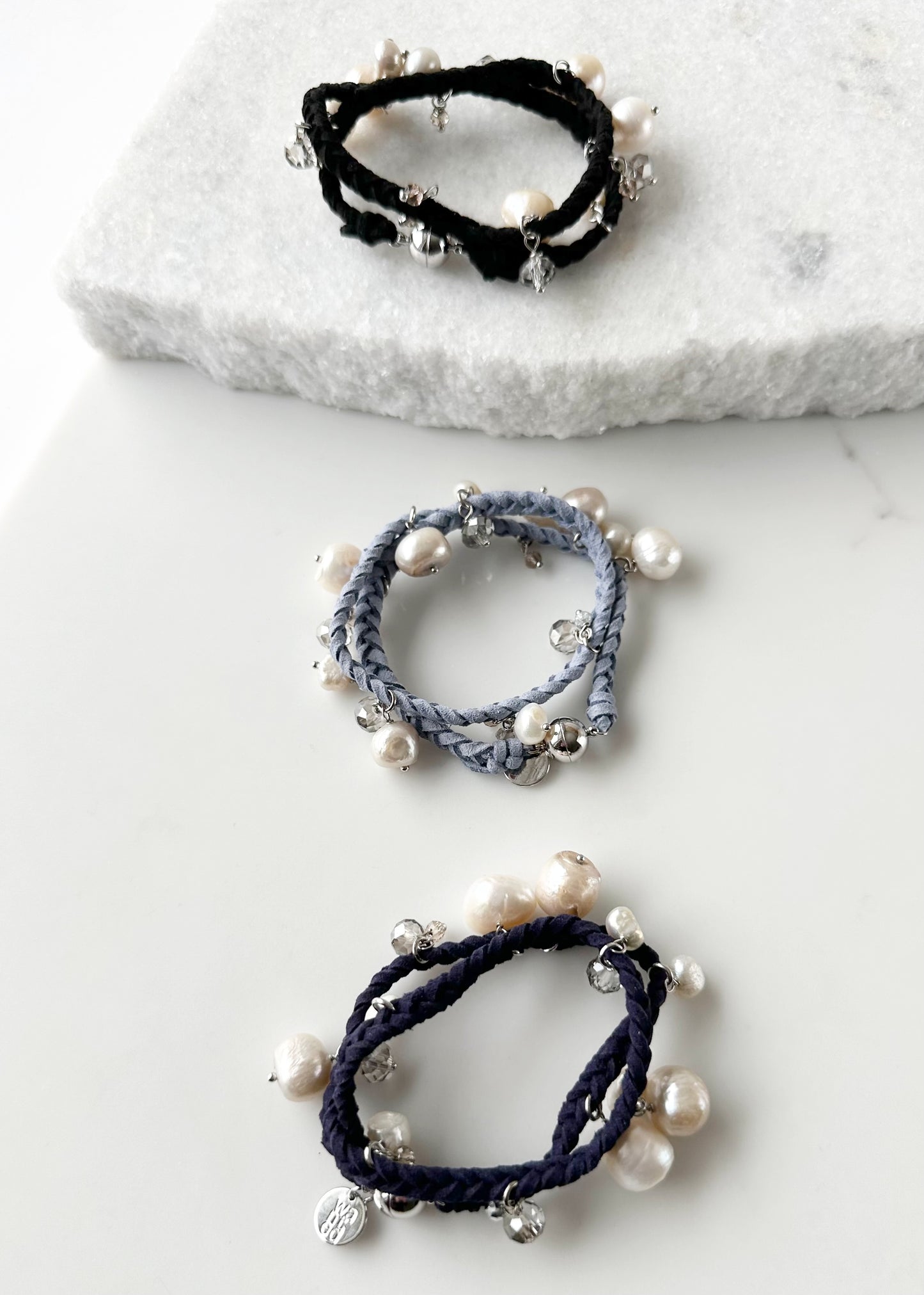 White and Champagne Baroque, Freshwater Pearls hang from this 14” Double Wrap Bracelet made of Vegan Suede in Blue, Black or Navy.  The piece is completed with crystal accents and a Strong Secure Magnetic Clasp for Easy Wear.