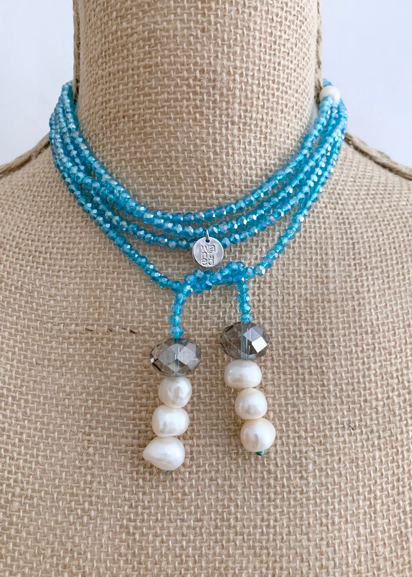 Long, 64-inch Lariat-Style Necklace with Blue Crystals and White Freshwater Pearls.  This Versatile piece allows it to be worn in many ways. Shown on Bust in another style