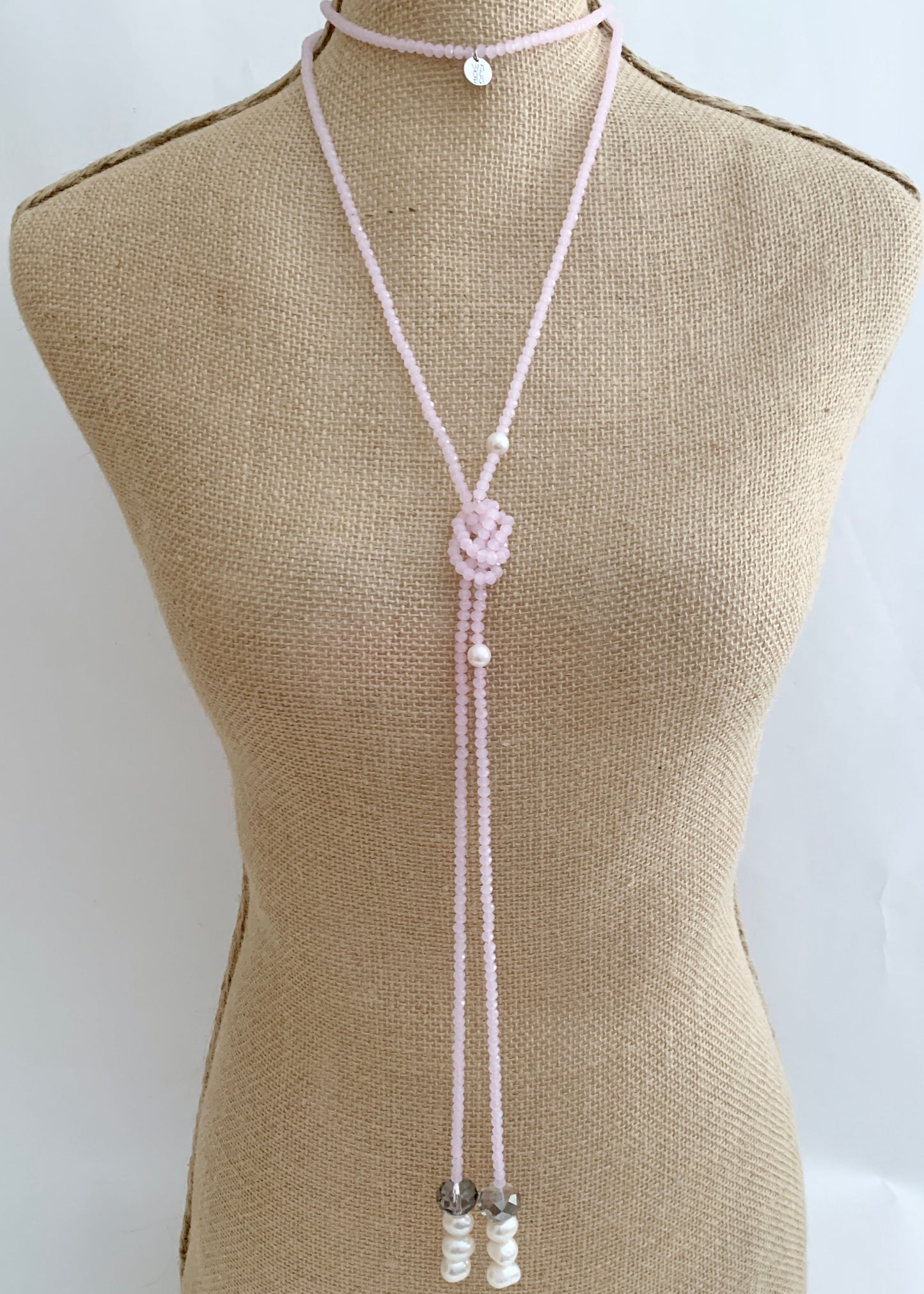 Long, 64-inch Lariat-Style Necklace with Pink Crystals and White Freshwater Pearls.  This Versatile piece allows it to be worn in many ways. Shown on Bust in one Style.