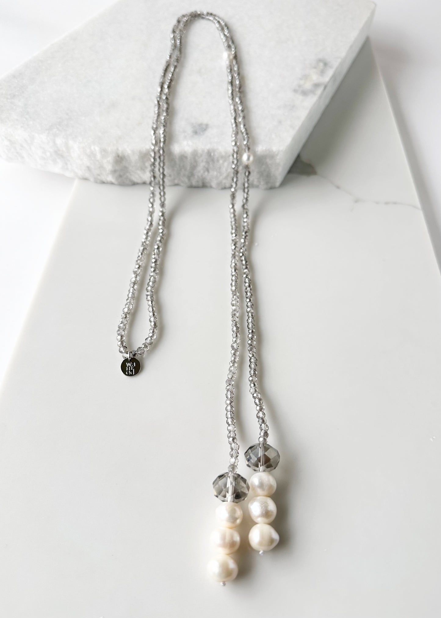 Long, 64-inch Lariat-Style Necklace with Smoke Crystals and White Freshwater Pearls.  This Versatile piece allows it to be worn in many ways.