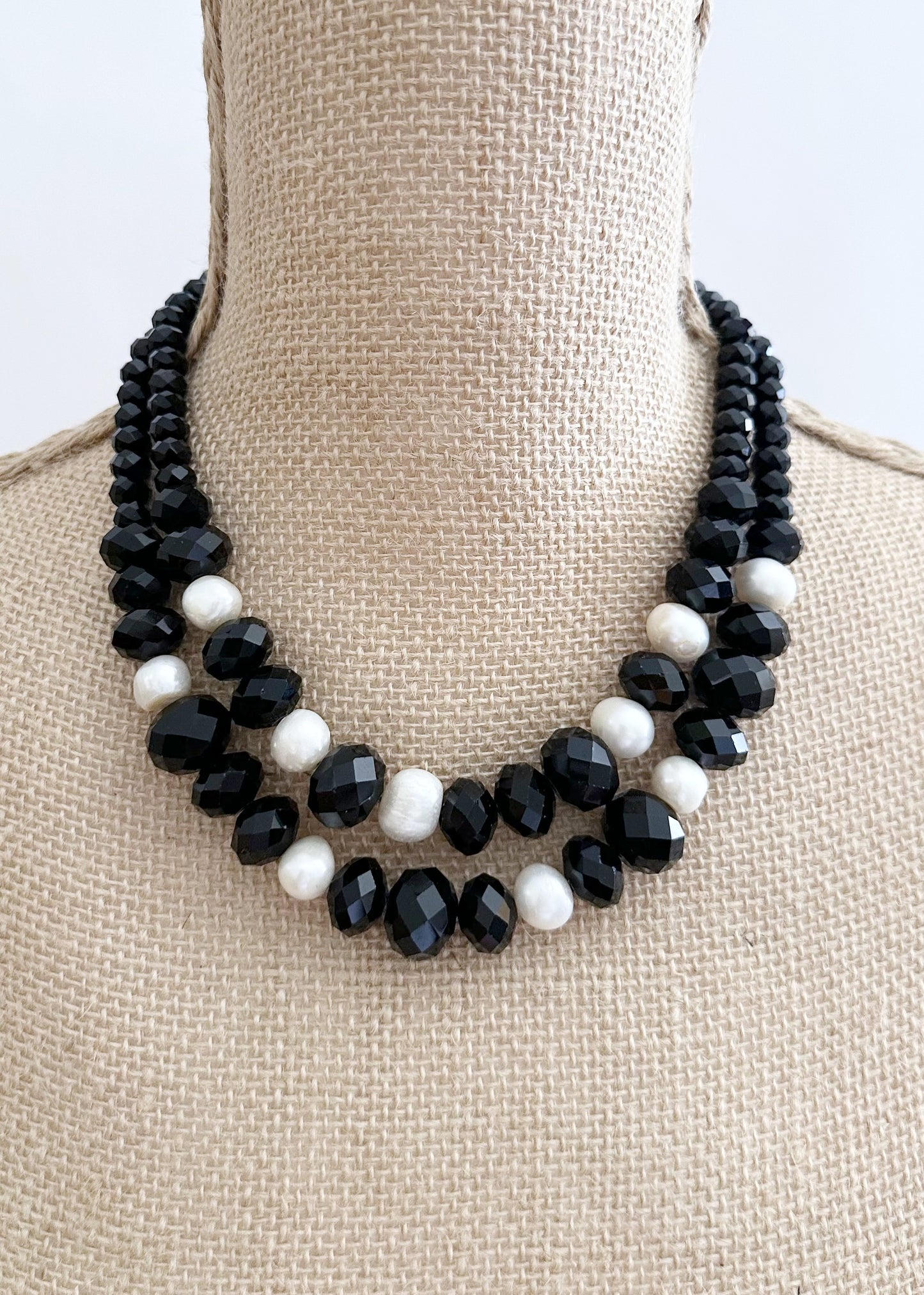 Two Strand White Freshwater Pearl Necklace with Large Faceted Black Crystals Joined by a Strong Secure Magnetic Clasp for Easy Wear. On Bust