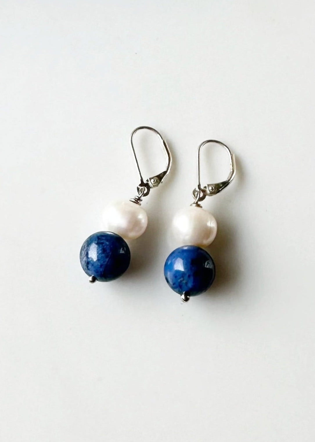 Blue dumortierite and white pearl earrings