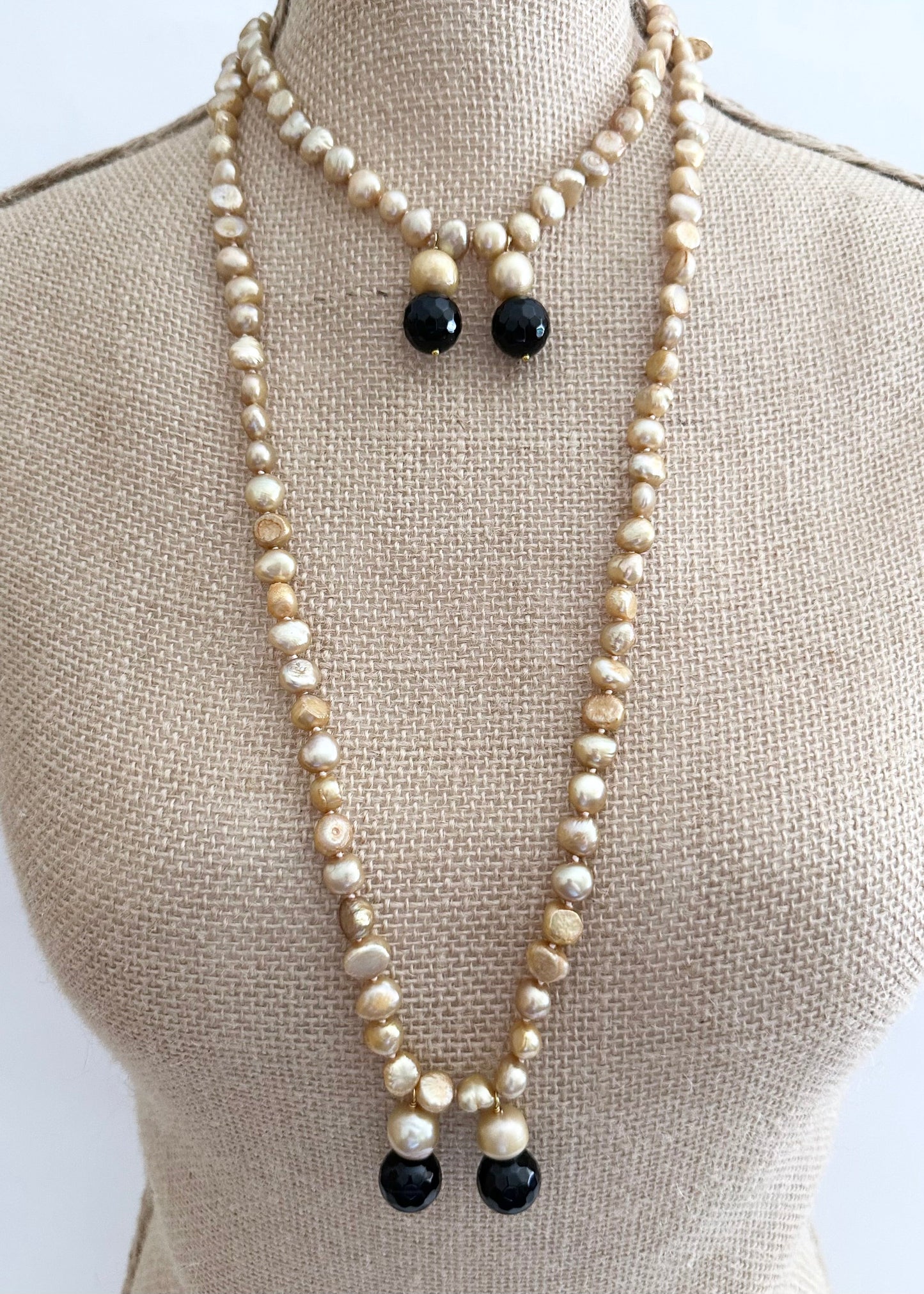 Long Generous Gold Freshwater Pearl Necklace with Larger Pearl and Black Agate drops.  Can be worn in many Styles. Style#3 On Bust