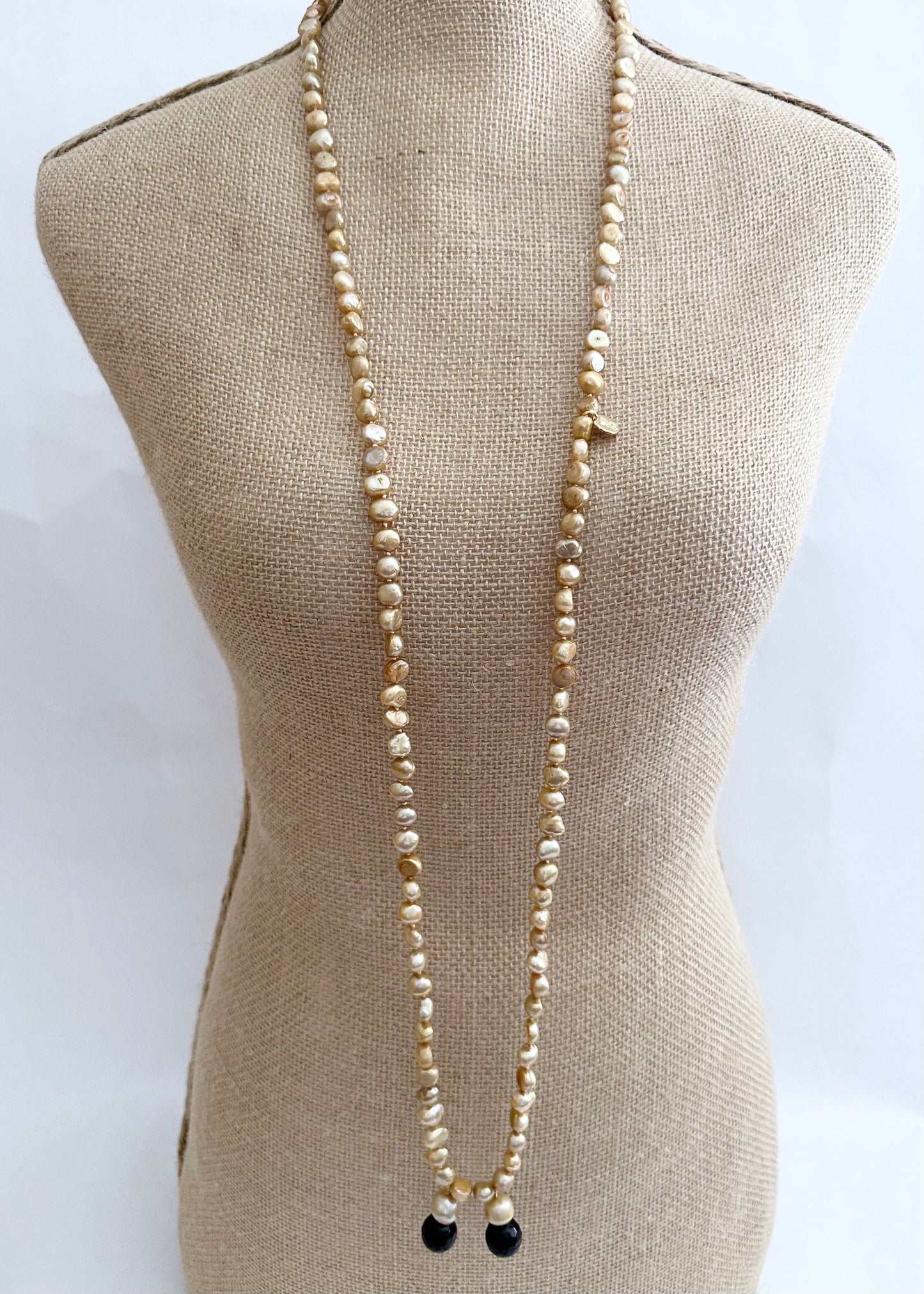 Long Generous Gold Freshwater Pearl Necklace with Larger Pearl and Black Agate drops.  Can be worn in many Styles. Style#3 On Bust