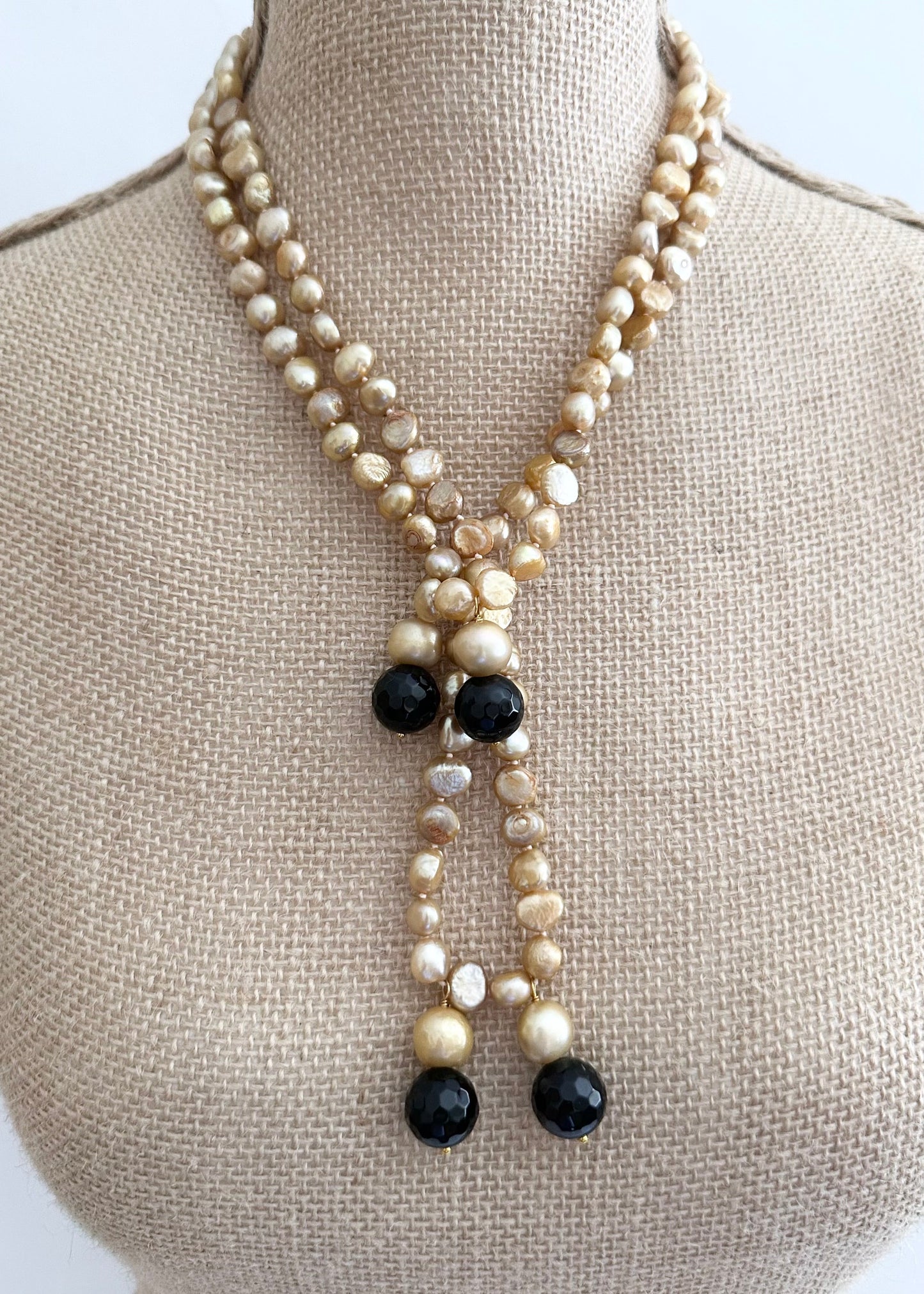 Long Generous Gold Freshwater Pearl Necklace with Larger Pearl and Black Agate drops.  Can be worn in many Styles. On Bust