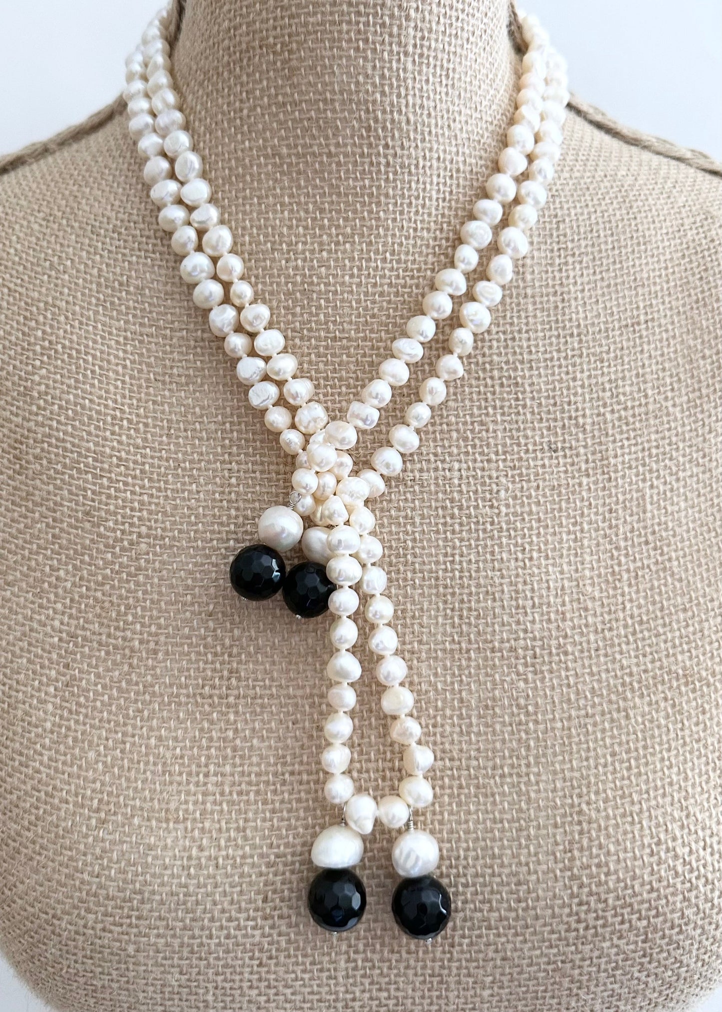 Long Generous White Freshwater Pearl Necklace with Larger Pearl and Black Agate drops.  Can be worn in many Styles. Style#2 On Bust
