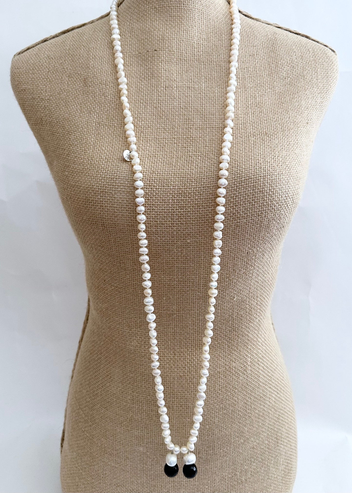 Long Generous Gold Freshwater Pearl Necklace with Larger Pearl and Black Agate drops.  Can be worn in many Styles. Style#4 On Bust