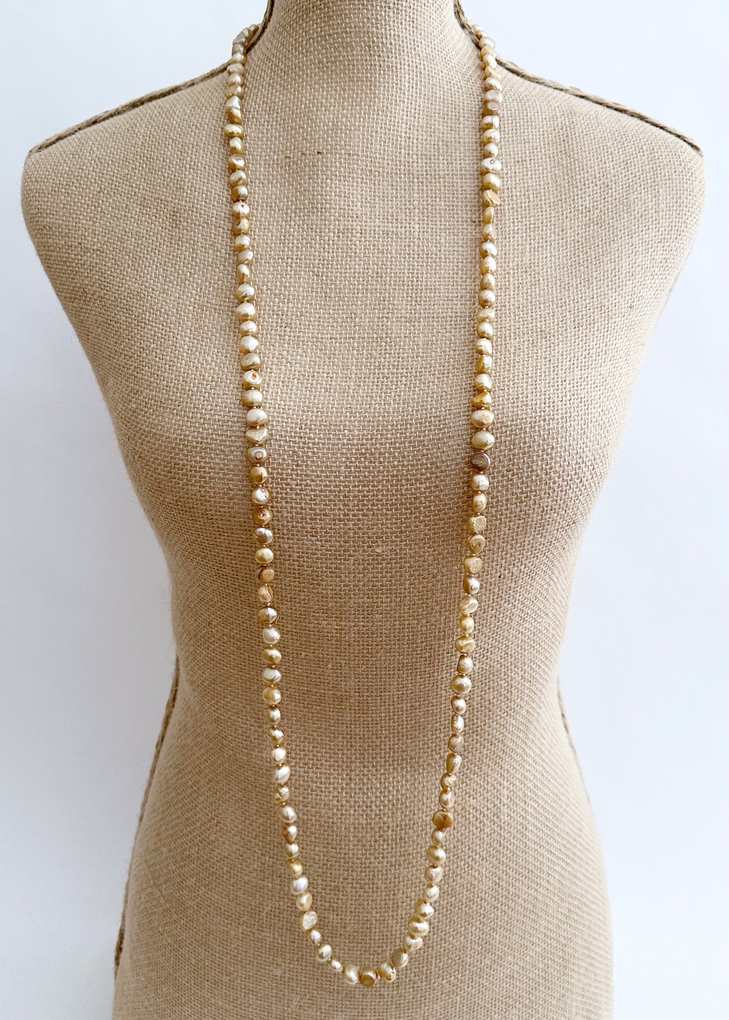 Long Necklace in Gold Baroque Freshwater Pearls. Wear as long Single strand or Doubled.