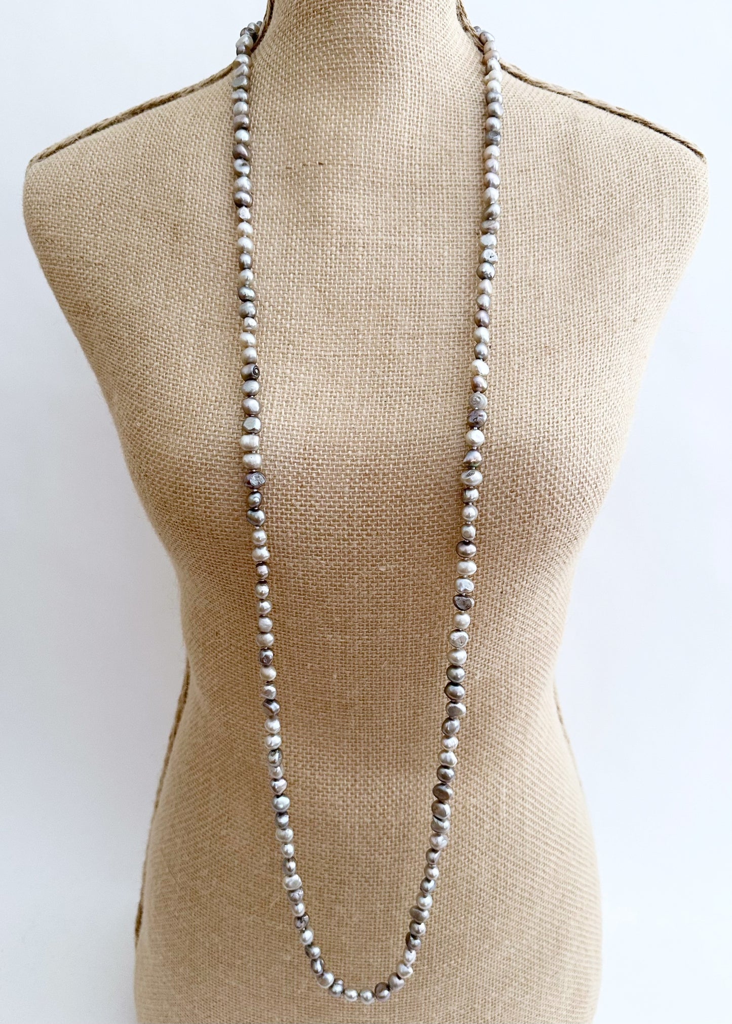 Long Necklace in Silver Baroque Freshwater Pearls. Wear as long Single strand or Doubled. On Bust
