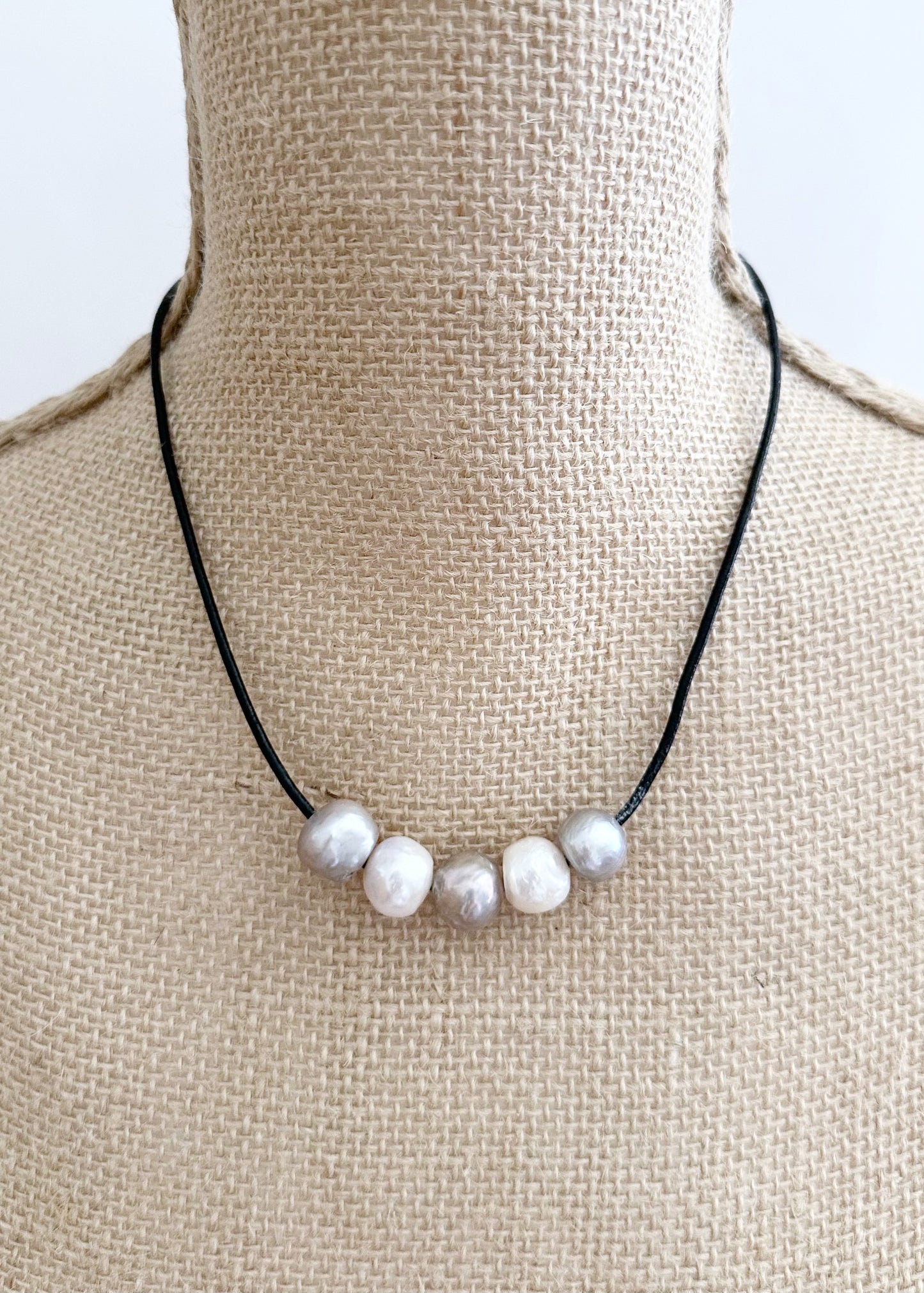Five Large Silver and White Freshwater Pearls Floating on Black Leather secured by a Strong Magnetic Clasp for Easy wear. On Bust