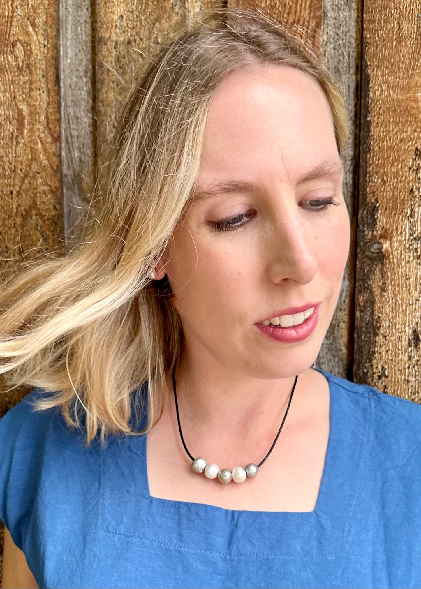 Five Large Silver and White Freshwater Pearls Floating on Black Leather secured by a Strong Magnetic Clasp for Easy wear. On Model