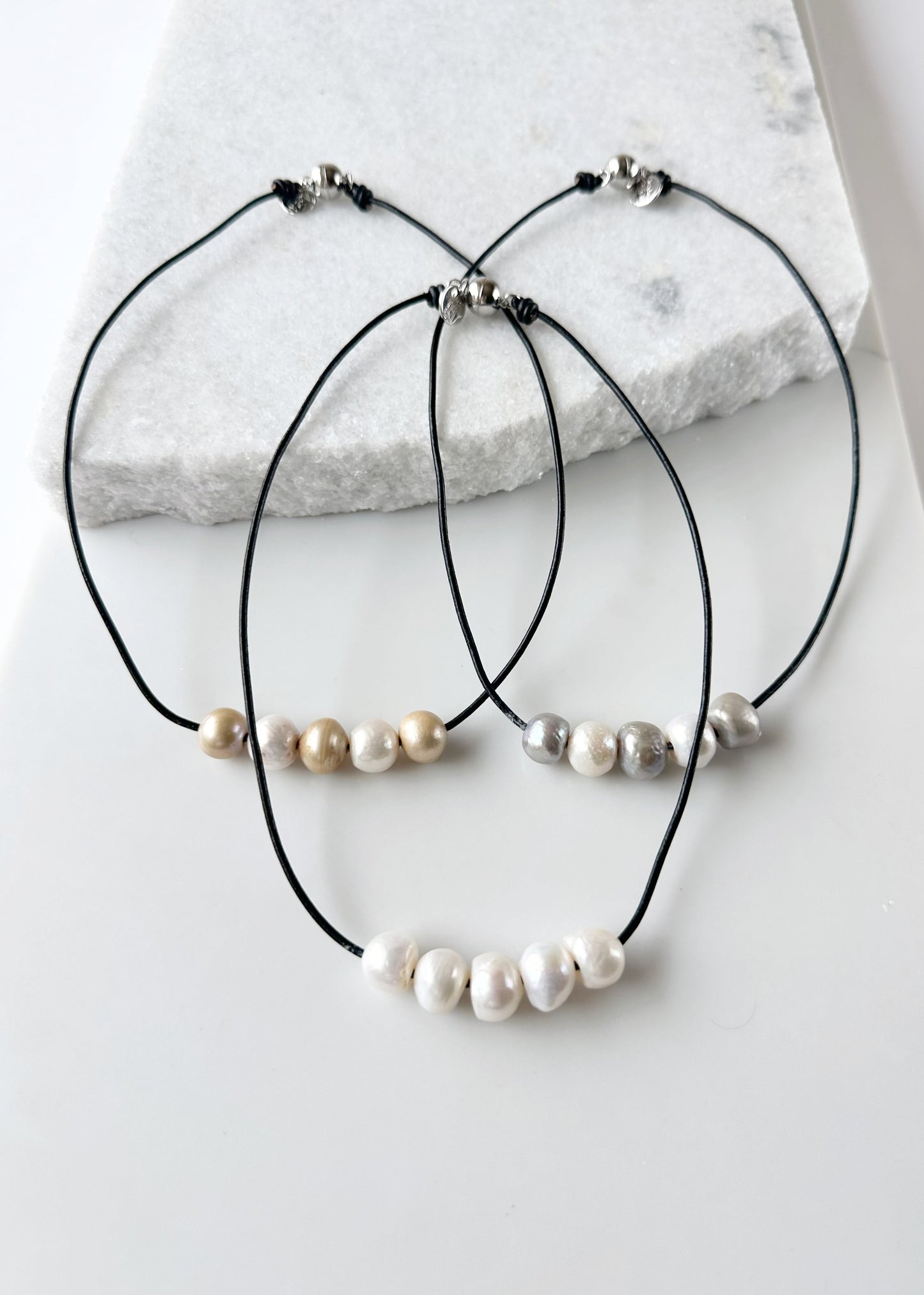 Five Large Freshwater Pearls Floating on Black Leather secured by a Strong Magnetic Clasp for Easy wear. Three Varieties shown