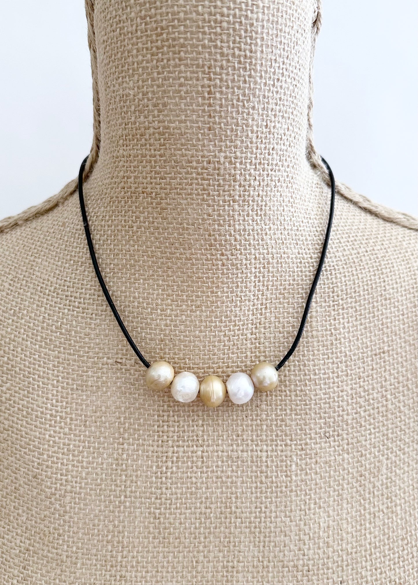 Five Large Gold and White Freshwater Pearls Floating on Black Leather secured by a Strong Magnetic Clasp for Easy wear. On Bust