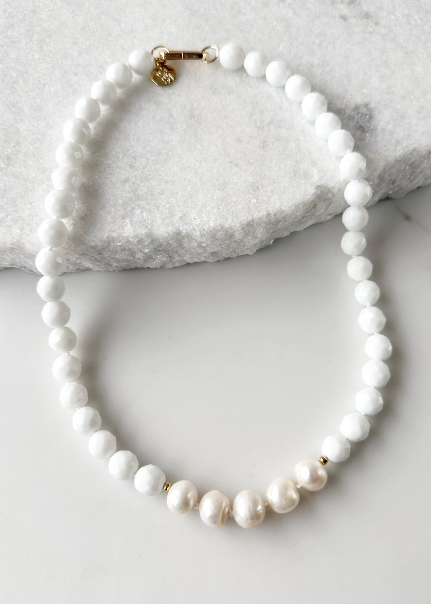 White Freshwater Baroque Pearls Strung with Faceted White Semi-Precious Stones with a Pretty Carved Shell Flower Pendant Hanging from a Gold-Plated Rectangular Clasp for a 18.5” Necklace.  This Necklace can be worn in Various ways. Shown without Pendant