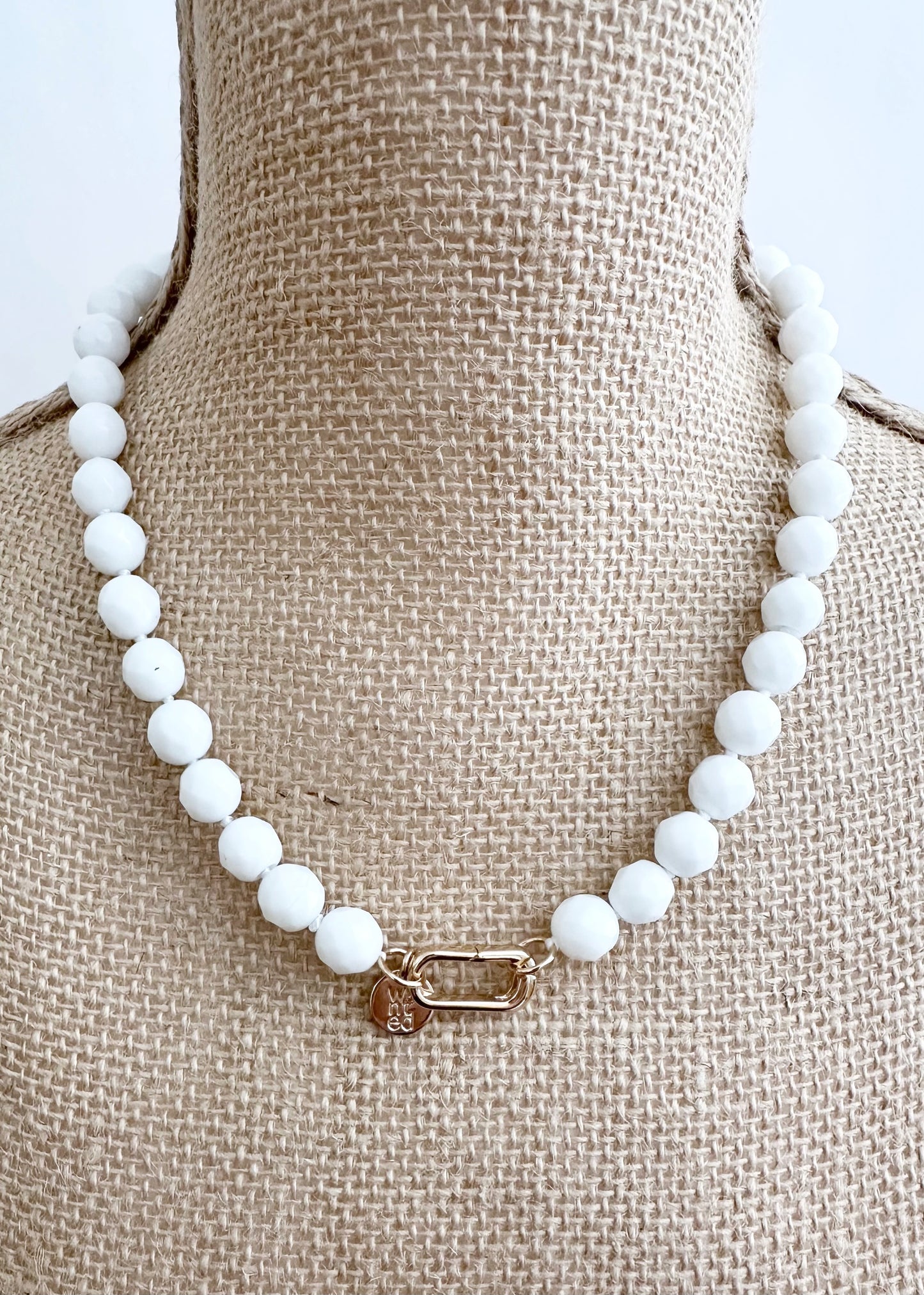 White Freshwater Baroque Pearls Strung with Faceted White or Blue Semi-Precious Stones with a Pretty Carved Shell Flower Hanging from a Gold-Plated Rectangular Clasp for a 18.5” Necklace.  This Necklace can be worn in Various ways. Without Pendant