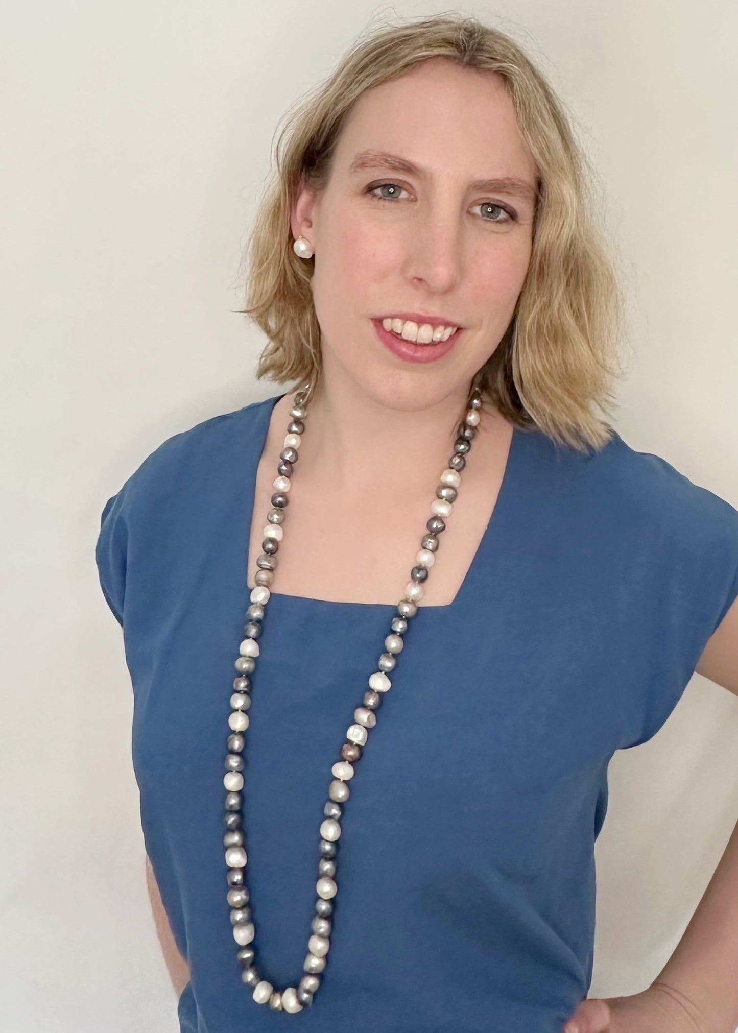 Large (12mm) Lustrous White Silver and Black Freshwater Pearls Knotted on a Long (36”) Necklace that allows for Single or Doubling Up. It is Completed with a Lobster Claw Clasp for Easy, Reliable Wear. On Model