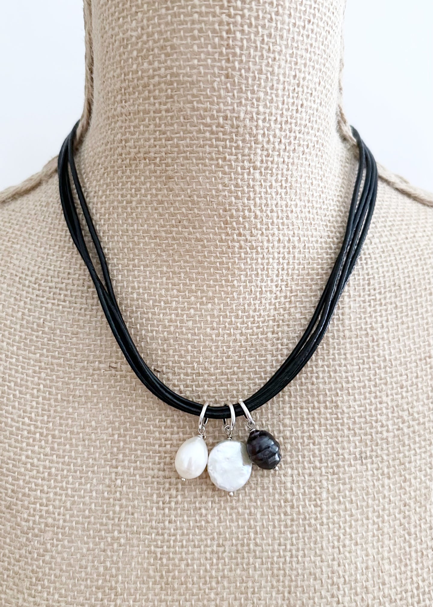 This 18.5” Necklace Features Three Beautiful Freshwater Pearls on Leather Cord to bring a subtle, elegant touch, Finished with a Magnetic Clasp for Easy Wear. Designed and Made in Canada