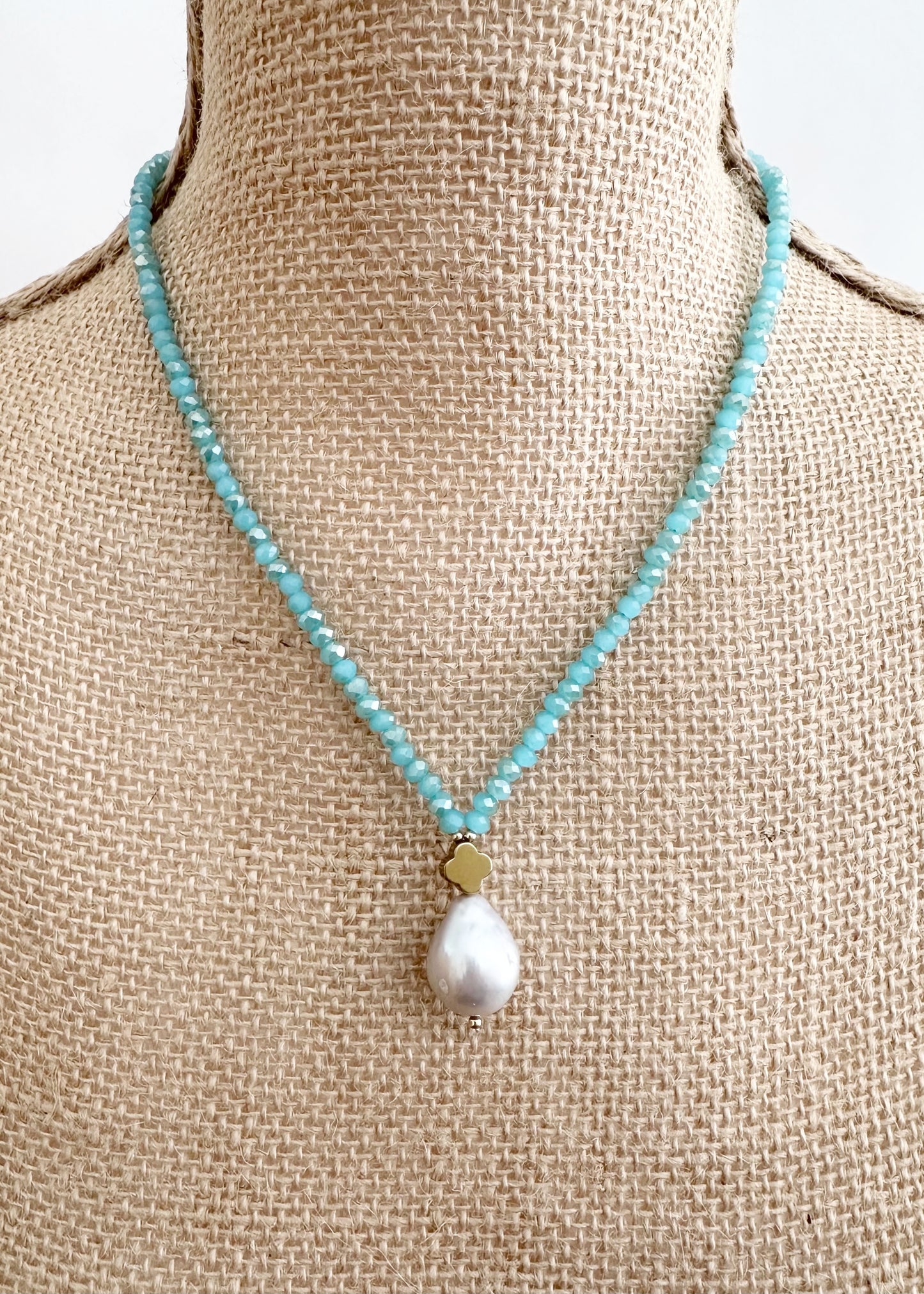 Faceted Pink Crystals form this Necklace with a Large Baroque Freshwater Pearl Pendant Completed with Gold accents and a Strong Secure Magnetic Clasp for East Wear. On Bust