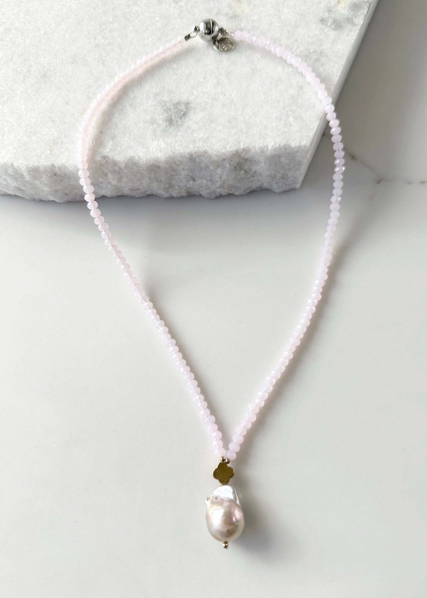 Faceted Pink Crystals form this Necklace with a Large Baroque Freshwater Pearl Pendant Completed with Gold accents and a Strong Secure Magnetic Clasp for East Wear.