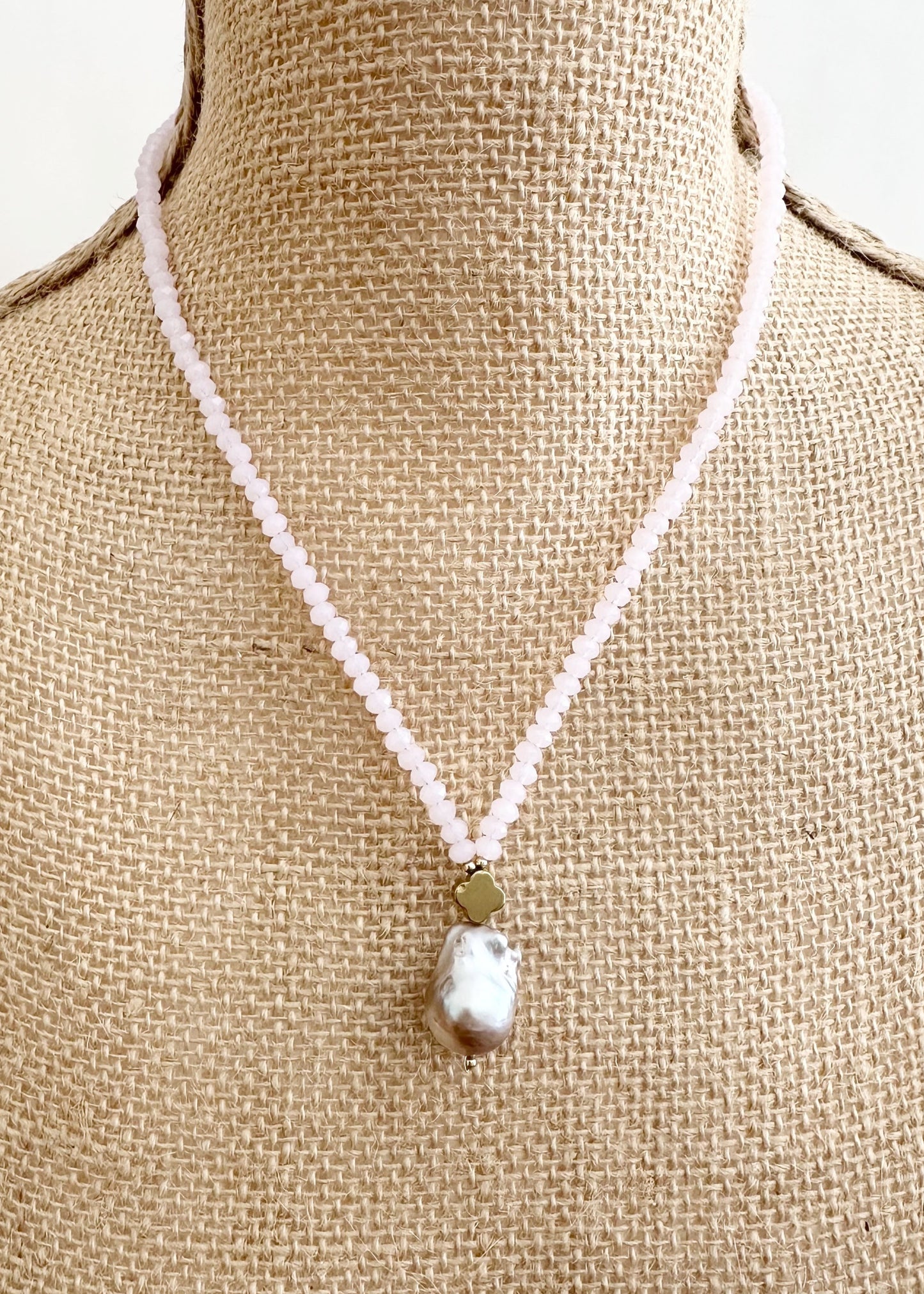 Faceted Pink Crystals form this Necklace with a Large Baroque Freshwater Pearl Pendant Completed with Gold accents and a Strong Secure Magnetic Clasp for East Wear. On Bust
