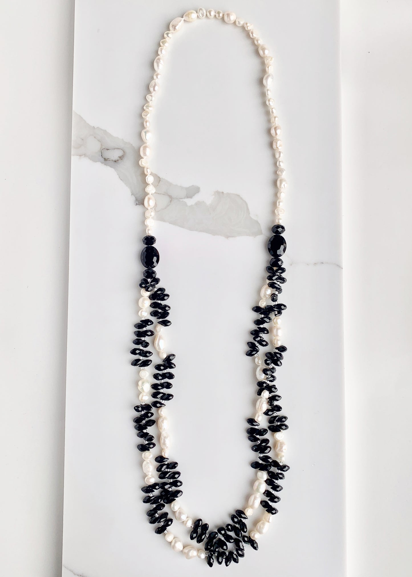 Two Strands of Black Crystal Briolettes with Small White Baroque Freshwater Pearls Accented by Larger Crystals on this Necklace with 21