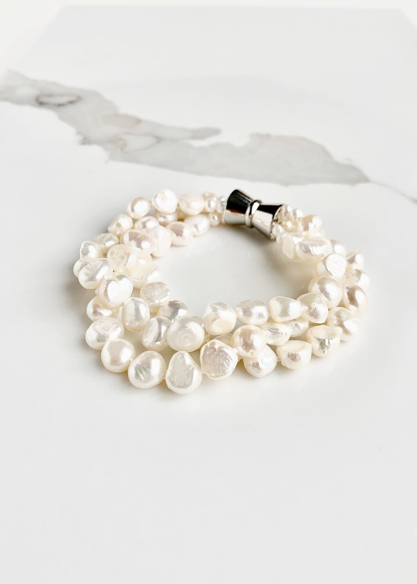 White Baroque 8-9mm Freshwater Knotted Pearls on 8” Long 3-Strand Bracelet with Magnetic Clasp for Easy Wear.