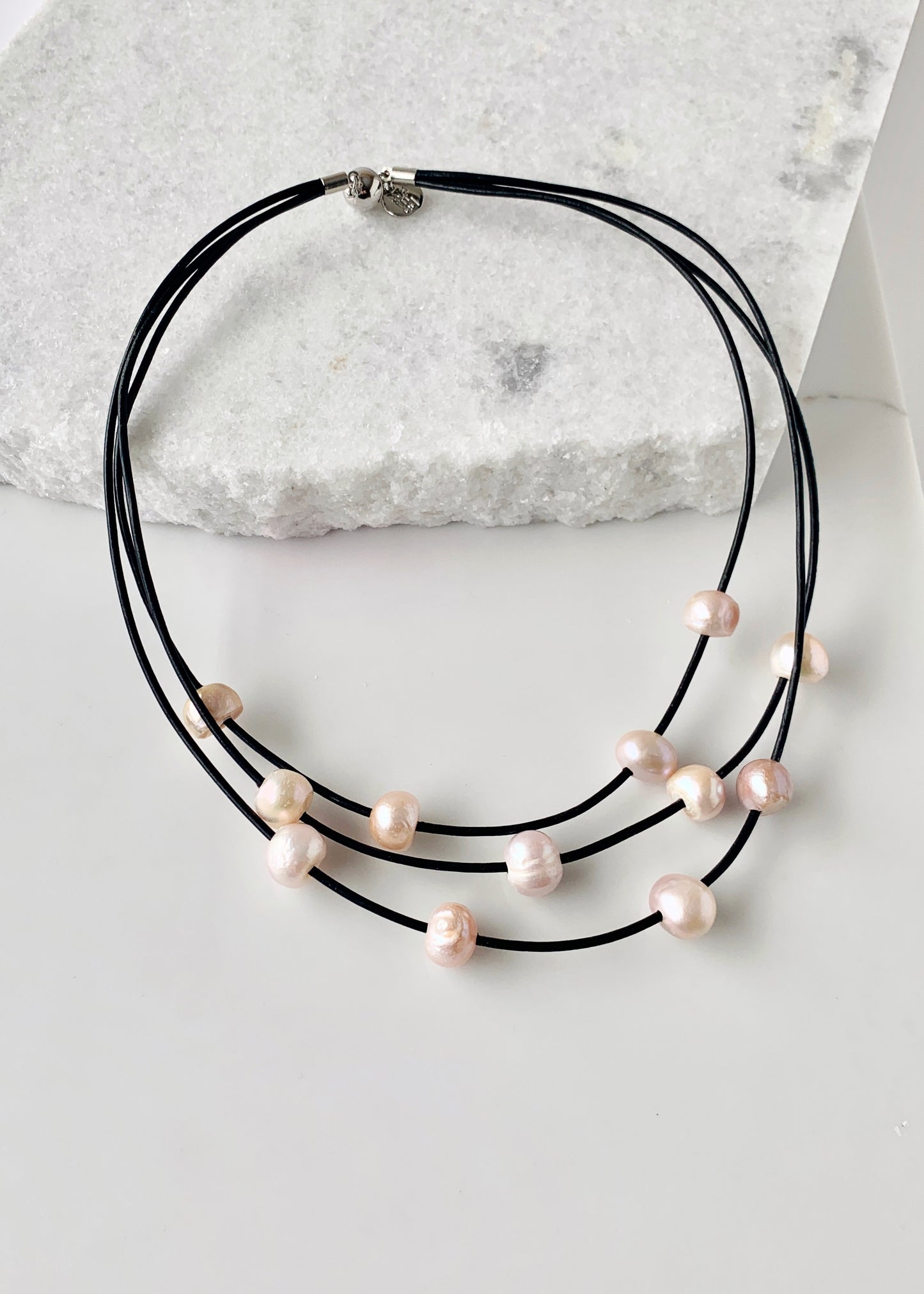Pink Baroque Freshwater Pearls on Three Graduated Strands of Black Leather Necklace with Strong Secure Magnetic Clasp for Easy Wear.