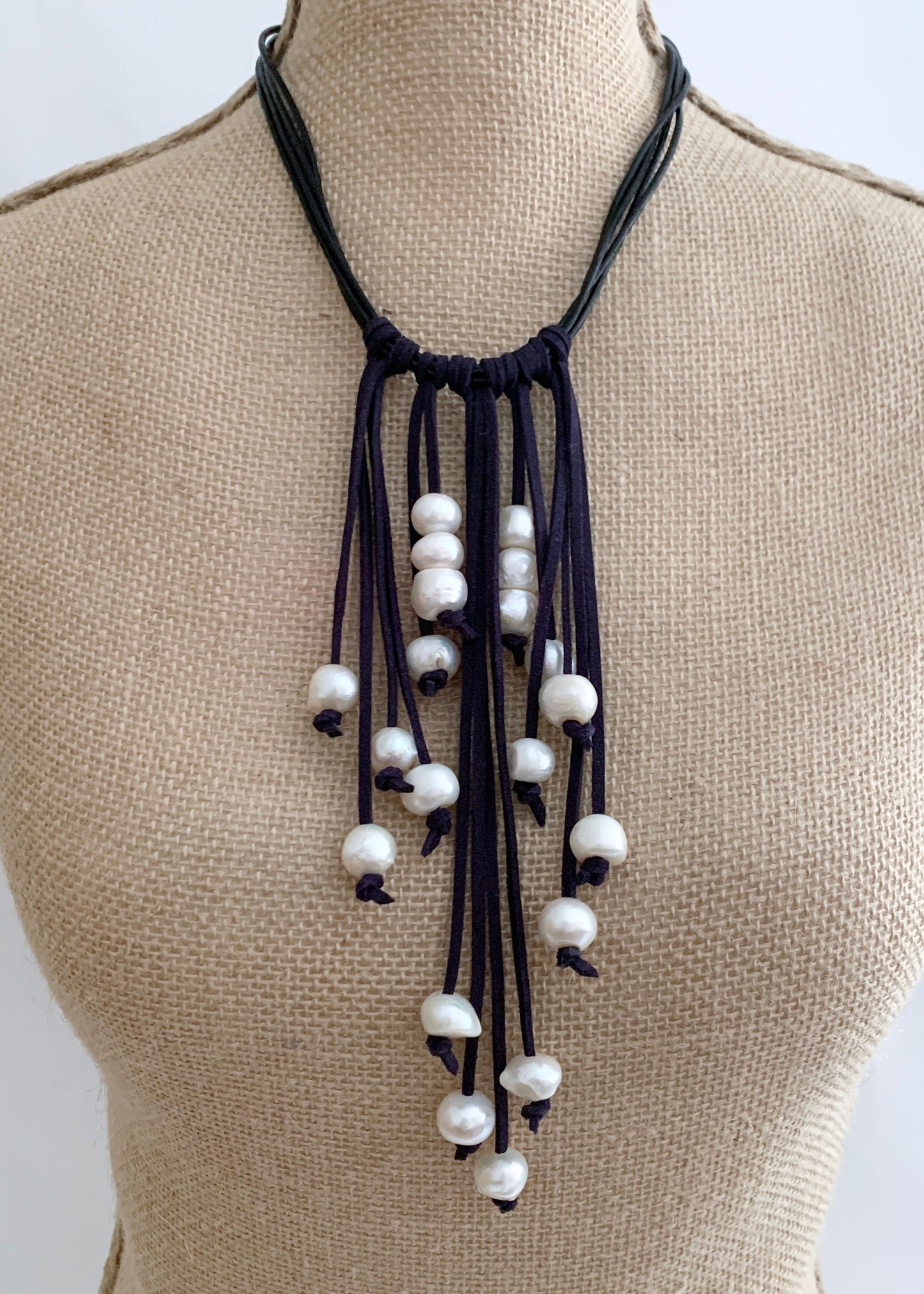 Large Baroque White Freshwater Pearls on Various-Length Strands with Black Vegan Suede and Leather Necklace Completed with a Strong Secure Magnetic Clasp for Easy Wear. On Bust
