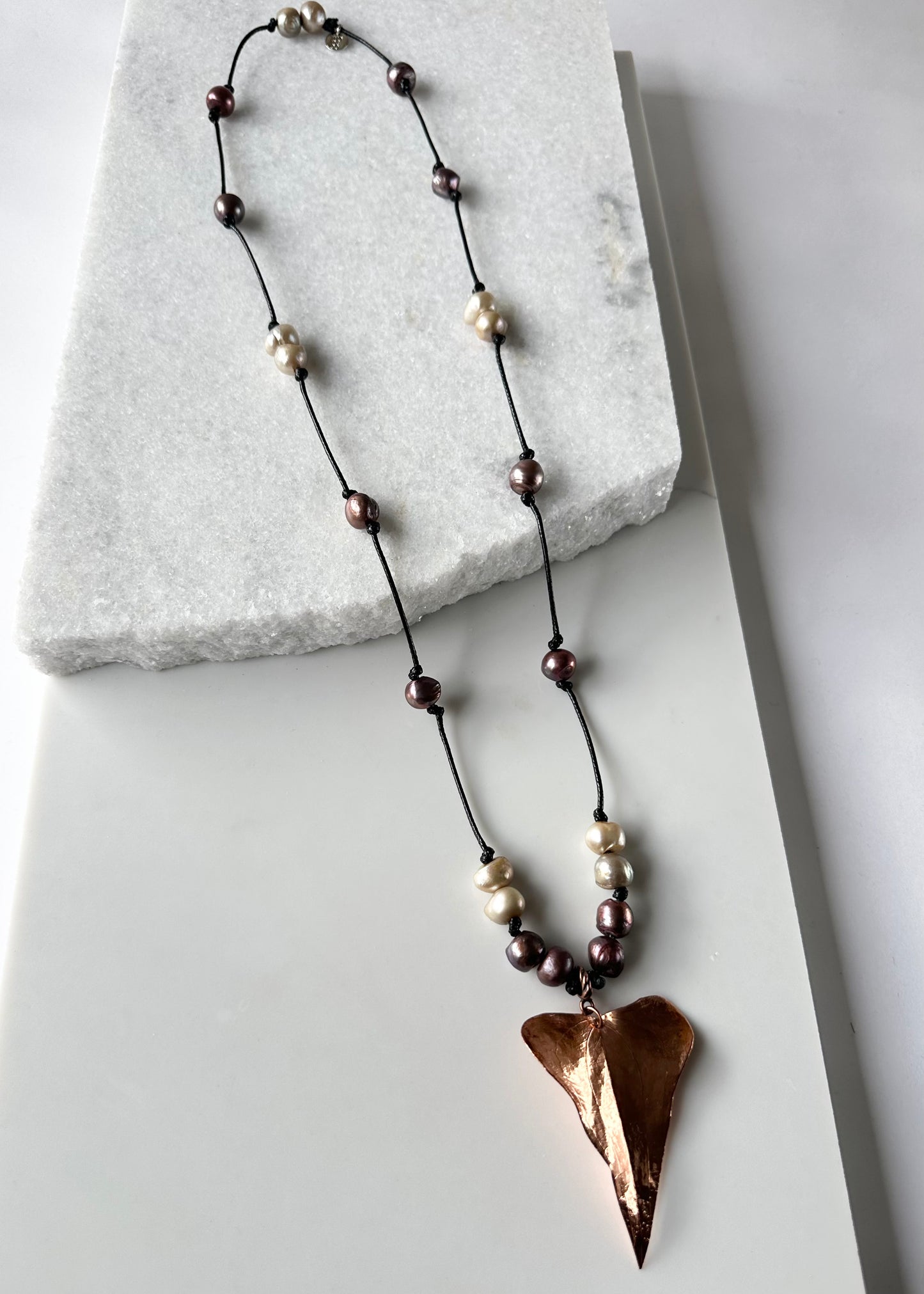 Beautiful Brown and Gold Baroque Freshwater Pearls Knotted on Black Cotton Cord with a Large Light  Copper Leaf Pendant.
