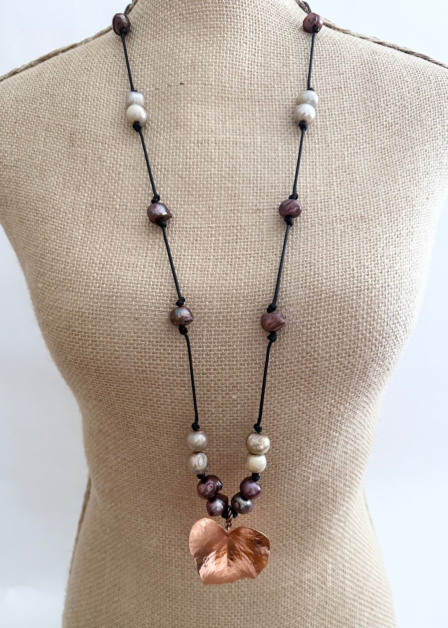 Beautiful Brown and Gold Baroque Freshwater Pearls Knotted on Black Cotton Cord with a Large Light  Copper Leaf Pendant. On Bust
