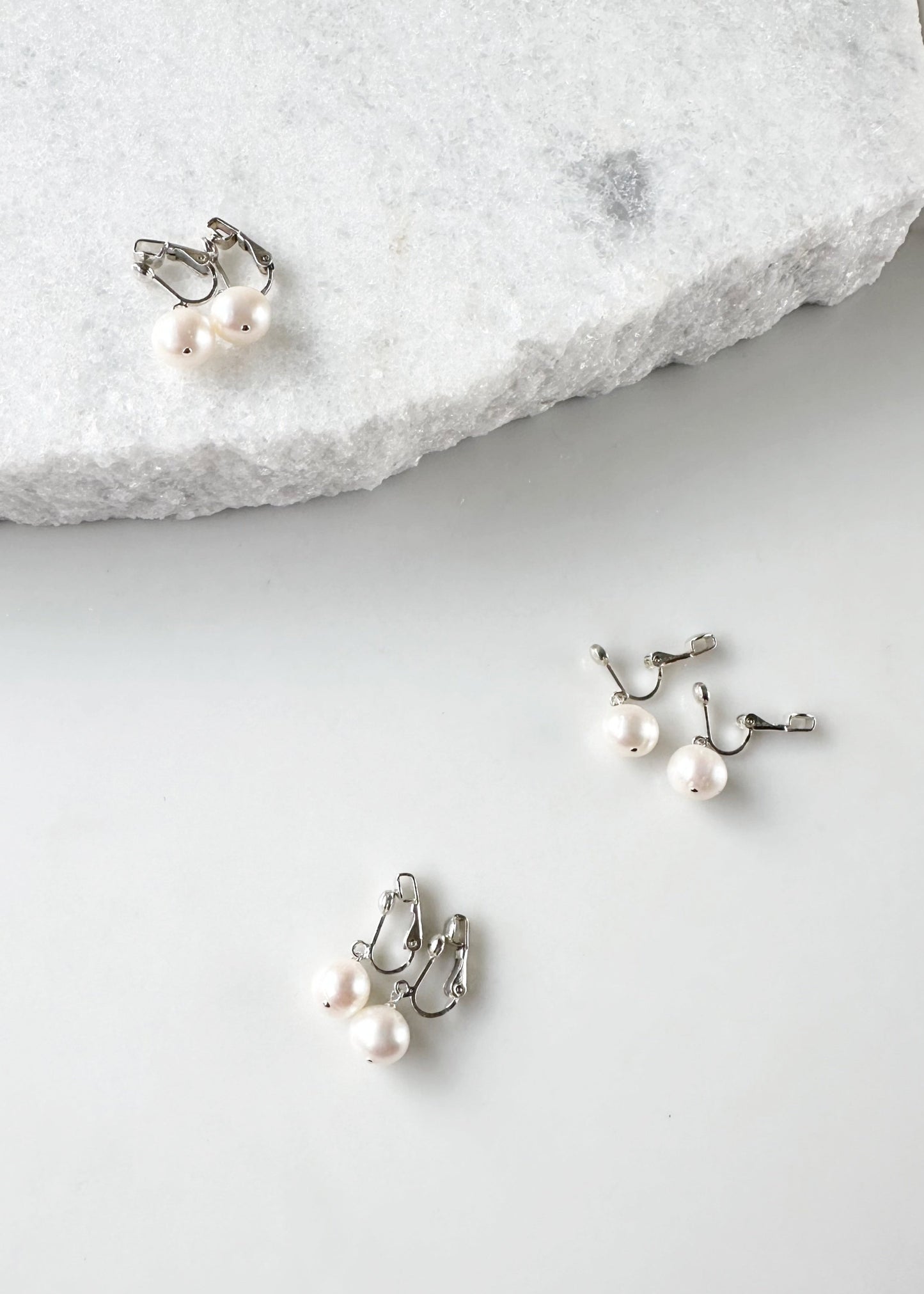 This Elegant Clip-On Earring Features a Beautiful Freshwater White 10mm Pearl Drop on Sterling Silver. Designed and made in Canada