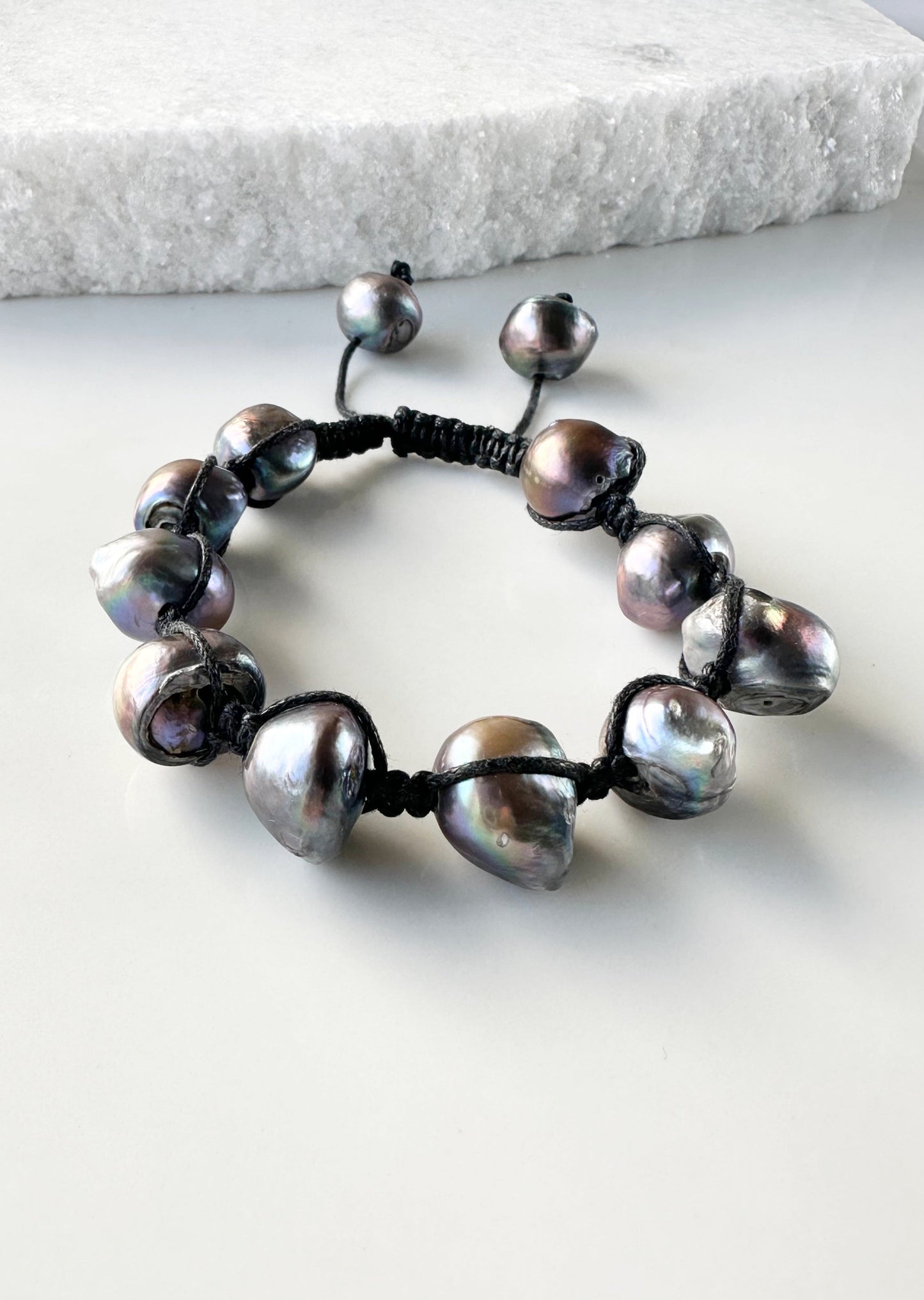 Nine Large Black Baroque Freshwater Pearls on Black Knotted Cord Plus Sliding Knot Closure with Two Smaller Pearls to Offer Adjustable Length.