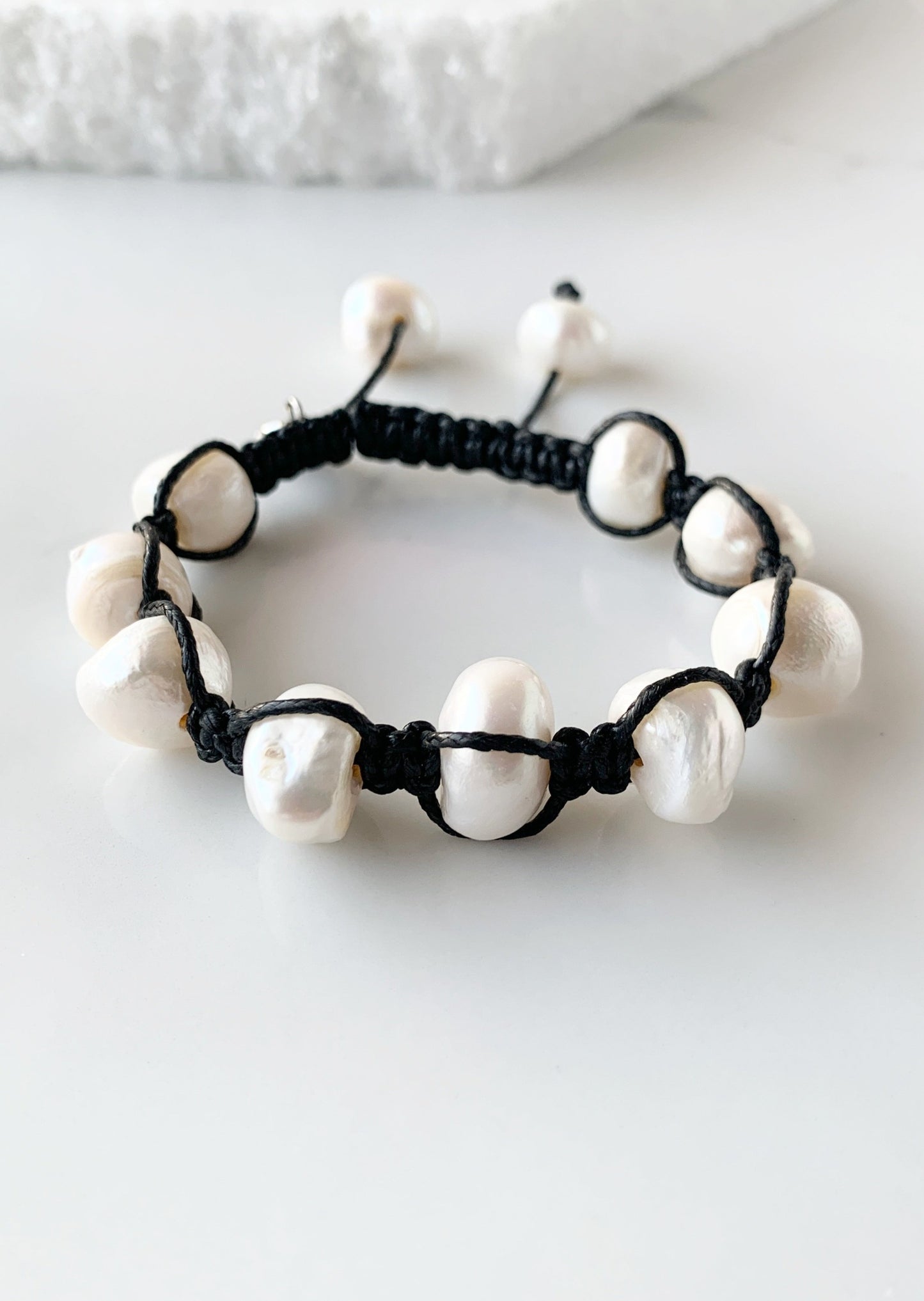 Nine Large White Baroque Freshwater Pearls on Black Knotted Cord Plus Sliding Knot Closure with Two Smaller Pearls to Offer Adjustable Length.