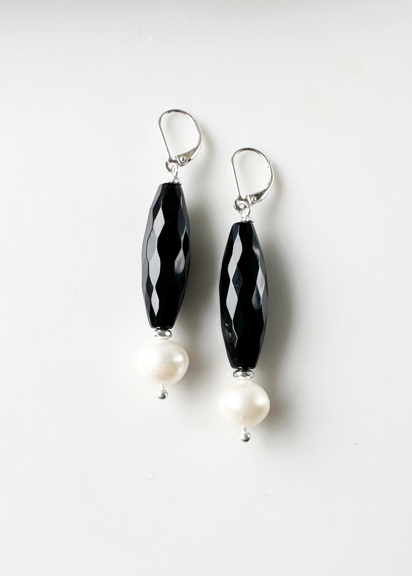 Large White Freshwater Pearls with Long Faceted Onyx with Sterling Silver Headpins and Lever Backs.