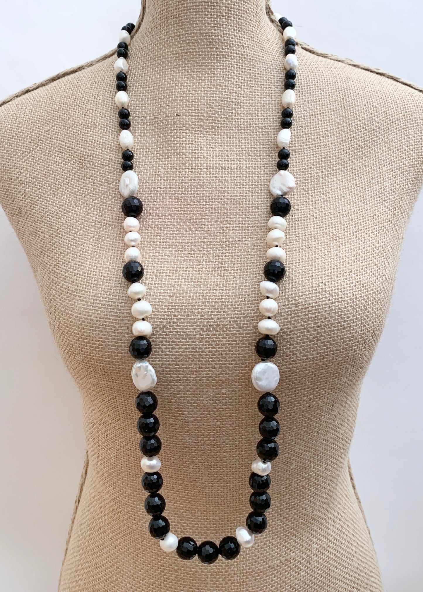 Large White Baroque and Coin Freshwater Pearls Adorn this Necklace with 8-14mm Faceted Black Agate. On Bust
