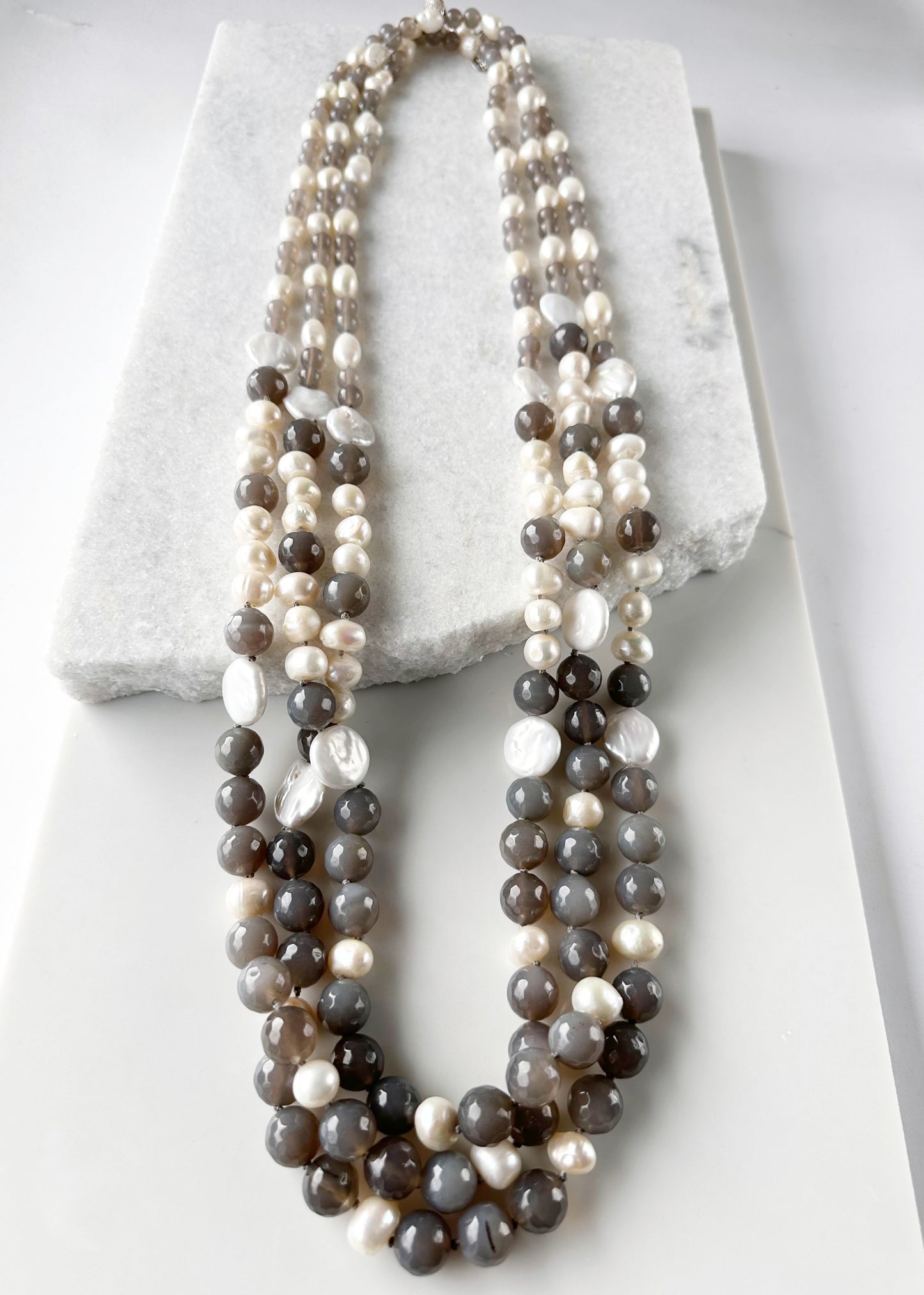 Large White Baroque and Coin Freshwater Pearls Adorn this Necklace with 8-14mm Faceted Grey Agate. Three Shown