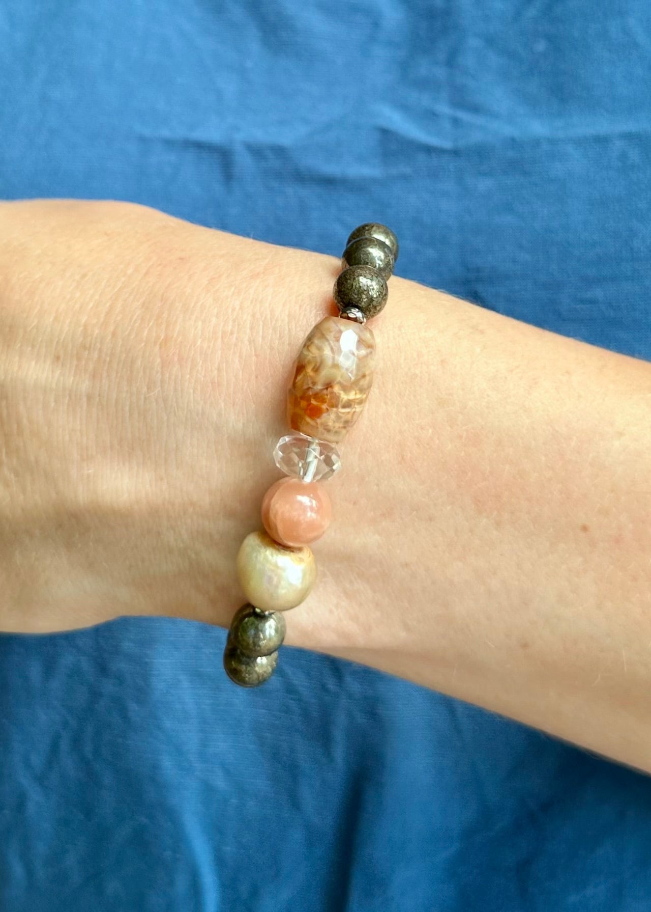 •	Fitting up to a 7” wrist, this Limited Edition Stretch Bracelet Boasts 8mm Pyrite, Freshwater Pearl, Moonstone, Quartz, Agate and Hematite. On Wrist
