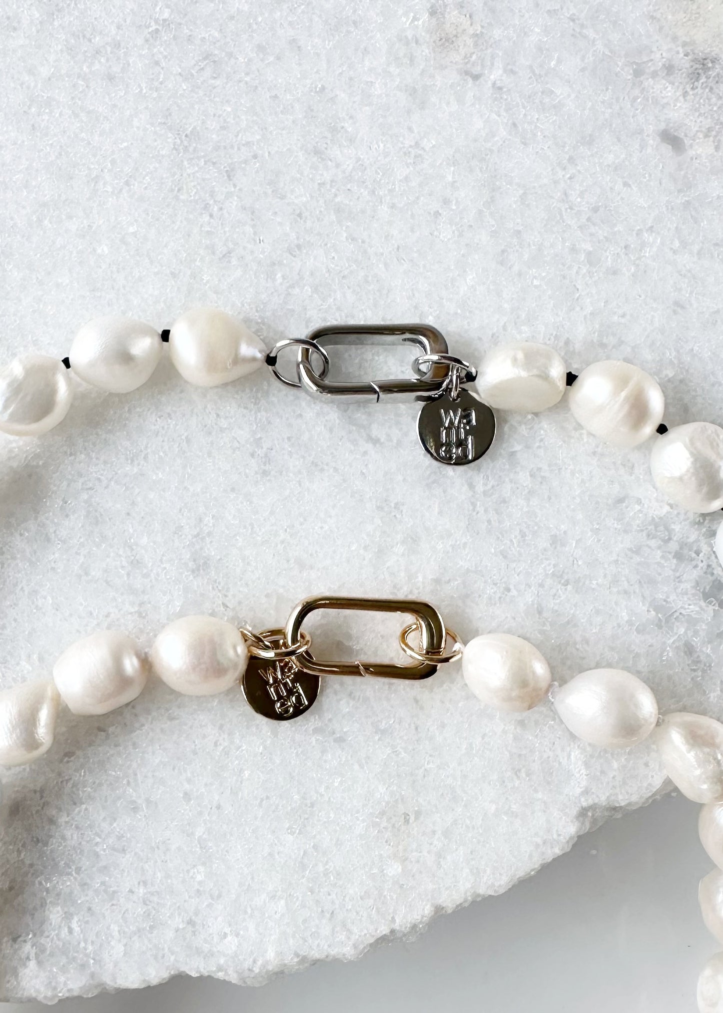 Lustrous Baroque Freshwater Pearls are Knotted in White or Black with a Gold or Silver Charm Clasp to Place your Favorite Pendants.  And Wear the 18.5” Necklace in Reverse to show off the Classic Pearls. Clasps highlighted.