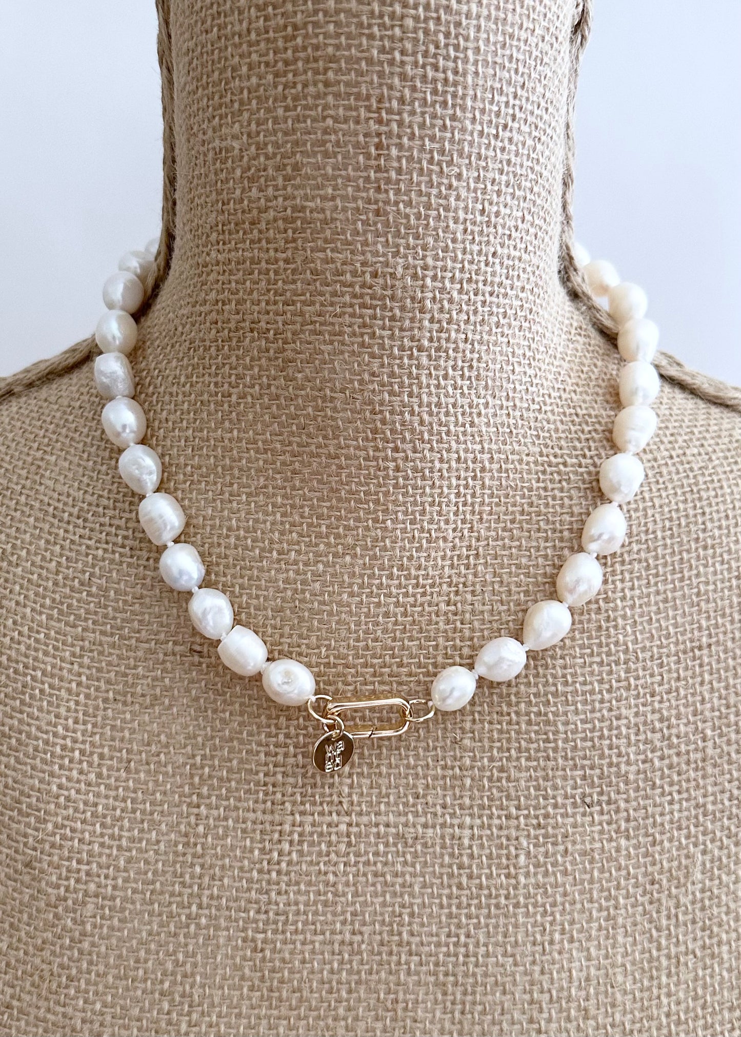 Lustrous Baroque Freshwater Pearls are Knotted in White with a Gold  Charm Clasp to Place your Favorite Pendants.  And Wear the 18.5” Necklace in Reverse to show off the Classic Pearls. On Bust