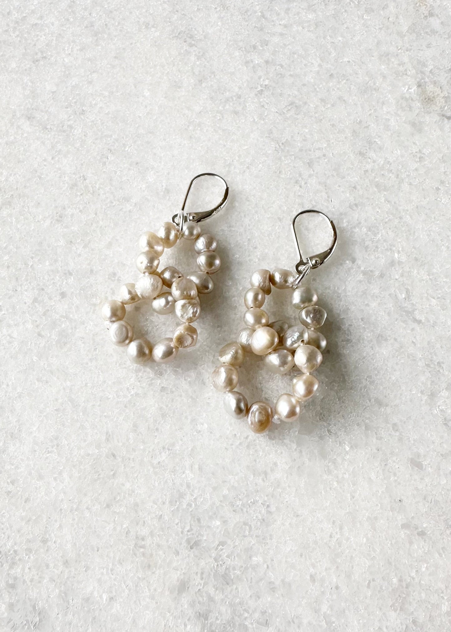 Two Linked Rings of Tiny  Champagne Baroque Freshwater Pearls highlight these Earrings with Sterling Silver Lever Backs.