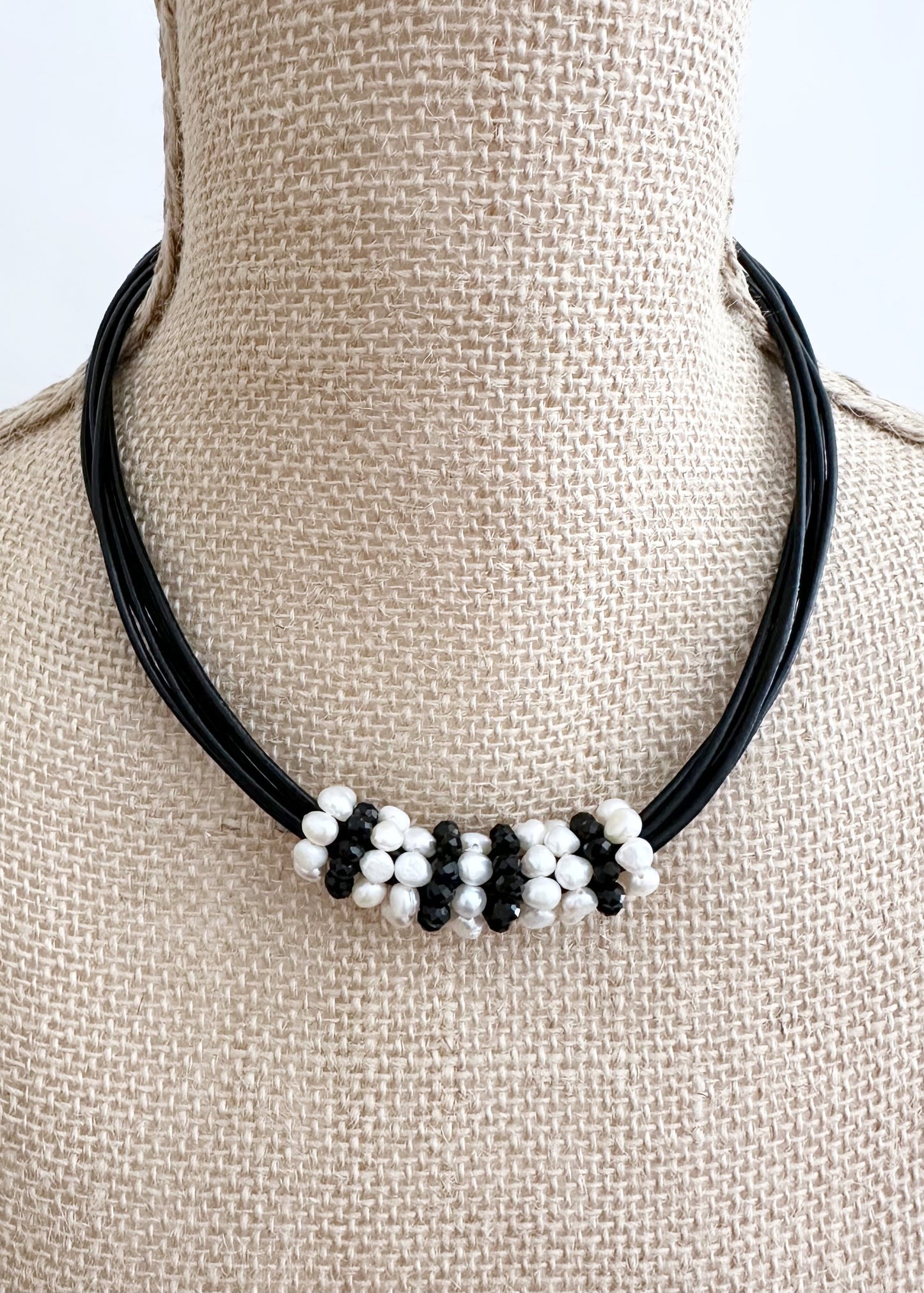 Pretty Baroque White Freshwater Pearl and Crystal Rings Float on Strands of Black 18” Long Leather in this Necklace, Finished by a Strong Secure Magnetic Clasp for Easy Wear.