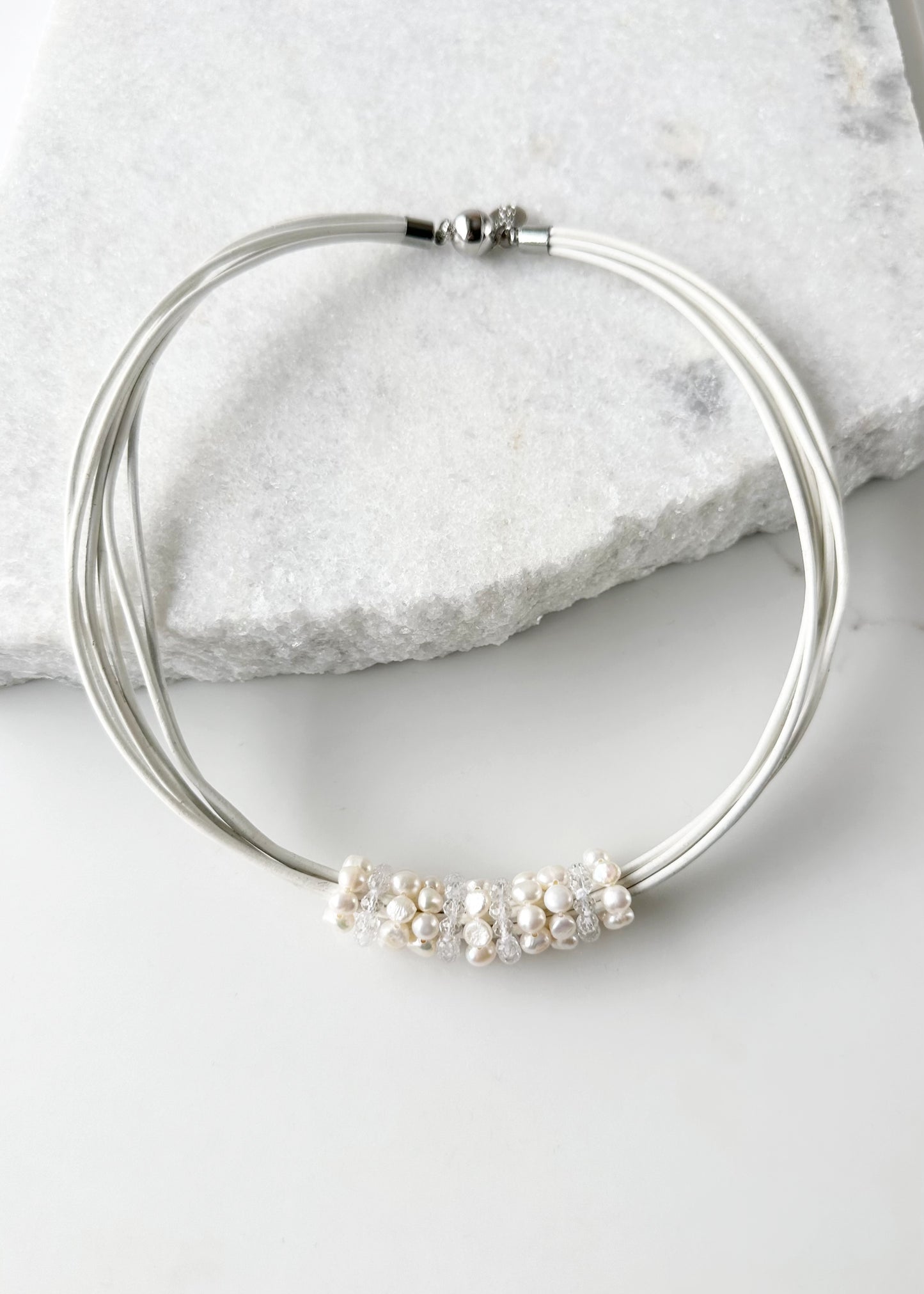 Pretty Baroque White Freshwater Pearl and Crystal Rings Float on Strands of White 18” Long Leather in this Necklace, Finished by a Strong Secure Magnetic Clasp for Easy Wear.