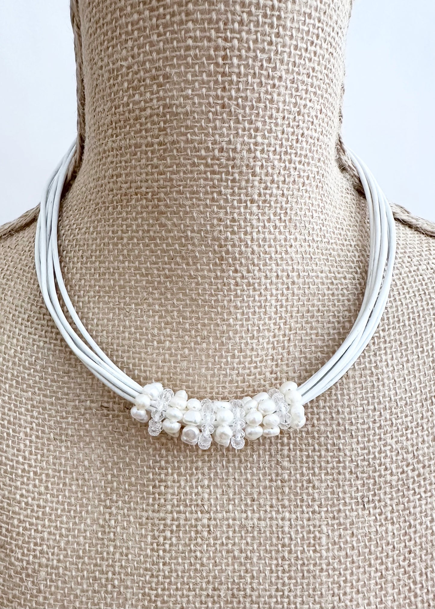 Pretty Baroque White Freshwater Pearl and Crystal Rings Float on Strands of White 18” Long Leather in this Necklace, Finished by a Strong Secure Magnetic Clasp for Easy Wear.