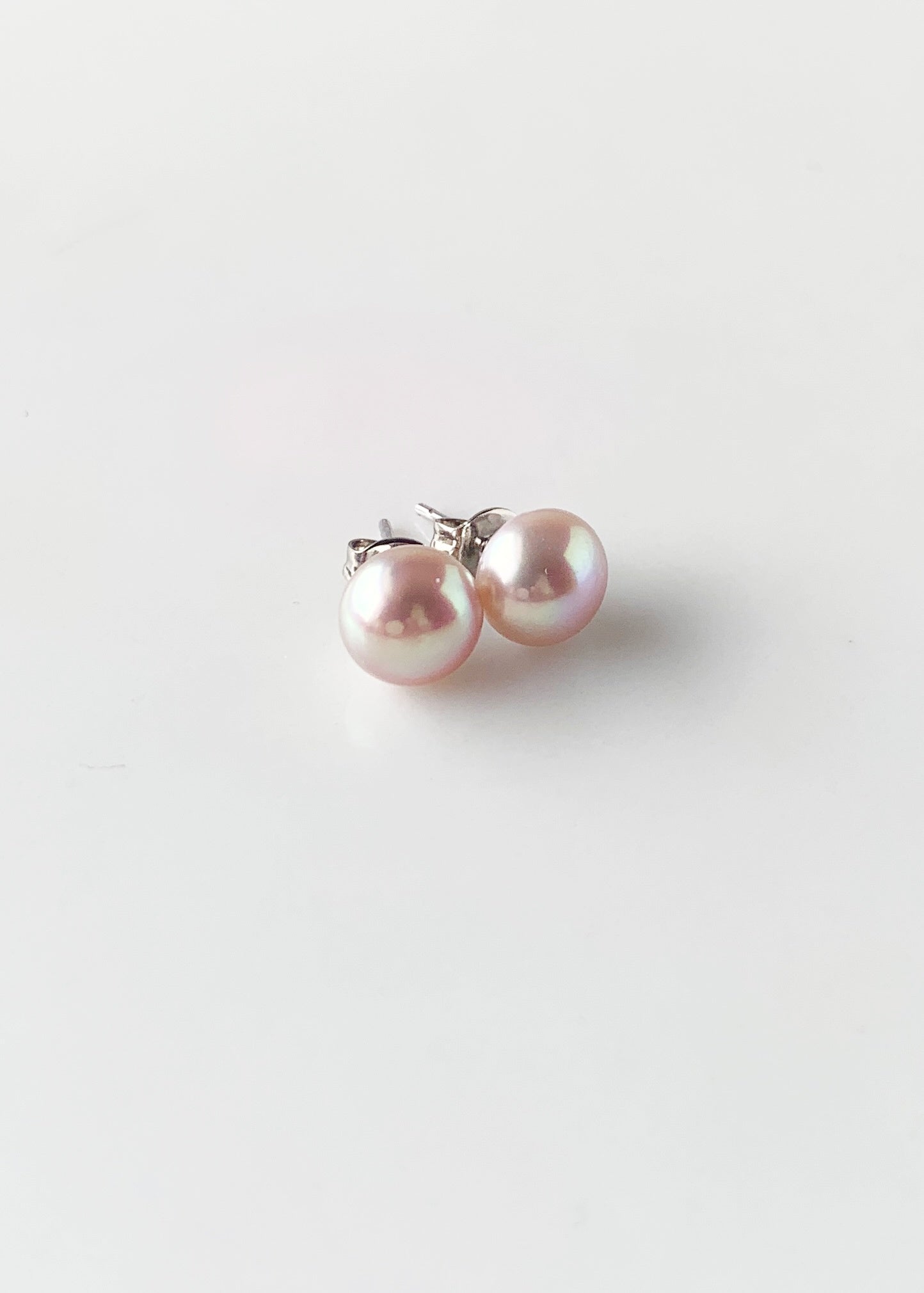 These Pretty Pink 8mm Freshwater Pearl Stud Earrings are on Sterling Silver Post and Butterfly.  A Fan Favorite!