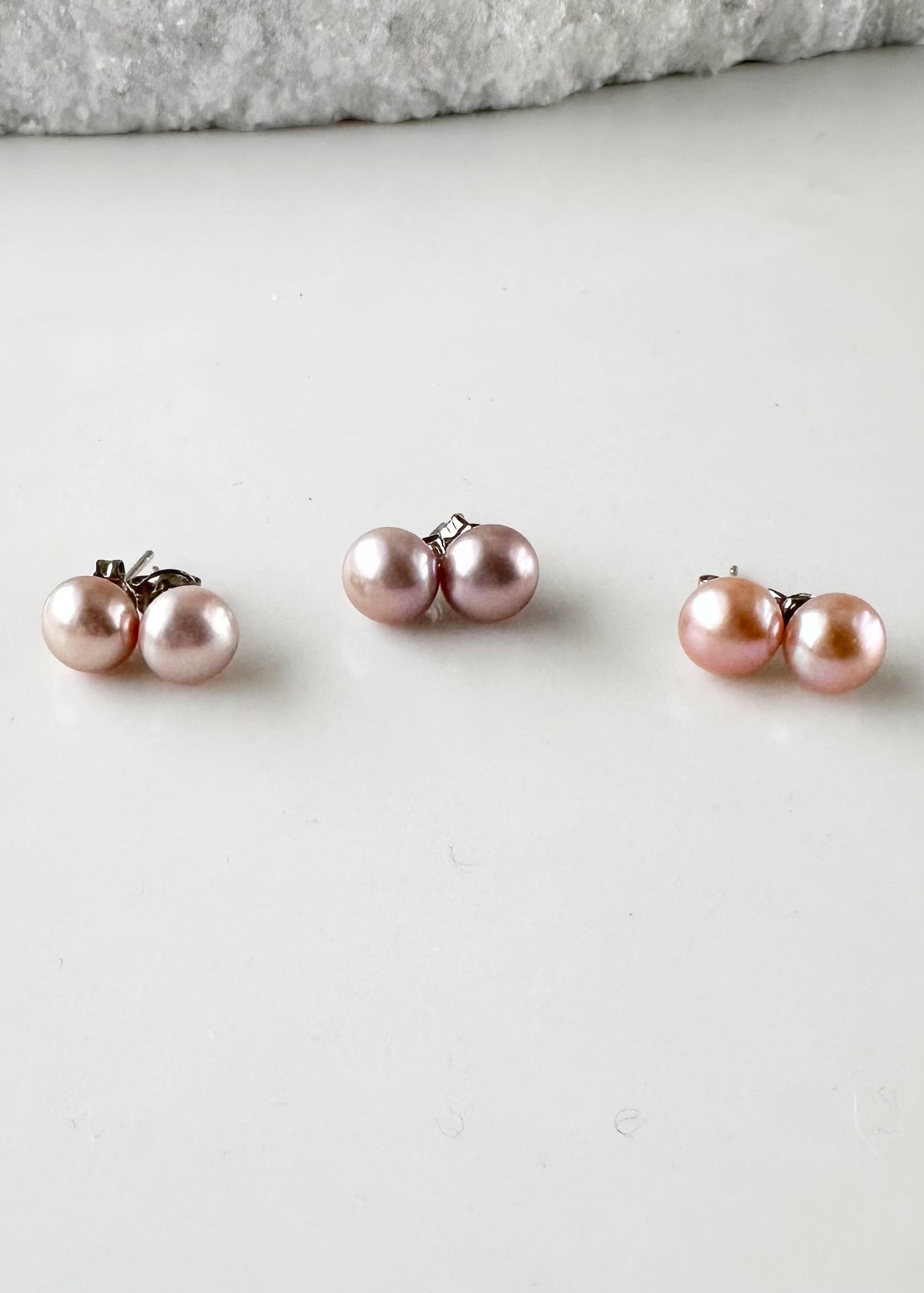 These Pretty Pink 8mm Freshwater Pearl Stud Earrings are on Sterling Silver Post and Butterfly.  A Fan Favorite! Three Showing Color Variation.