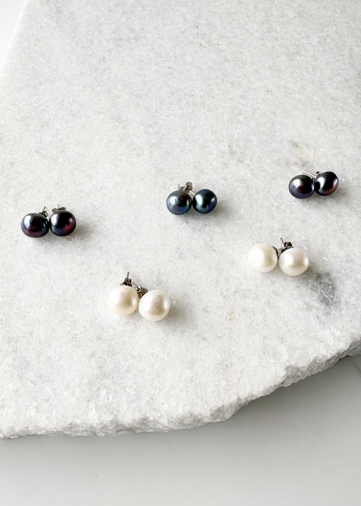 These Pretty Black or White 10-11mm Freshwater Pearl Stud Earrings are on Sterling Silver Post and Butterfly.  A Fan Favorite!
